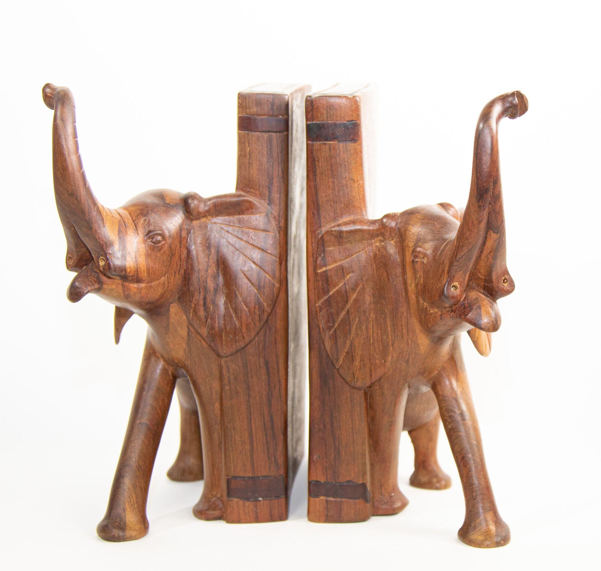 Large Vintage Hand-Carved wood elephant bookends.
Nice pair of hand-carved wooden elephant bookends.
Elephant animal sculptures book ends handcrafted in Rajasthan, India.
Each book end is: 10
