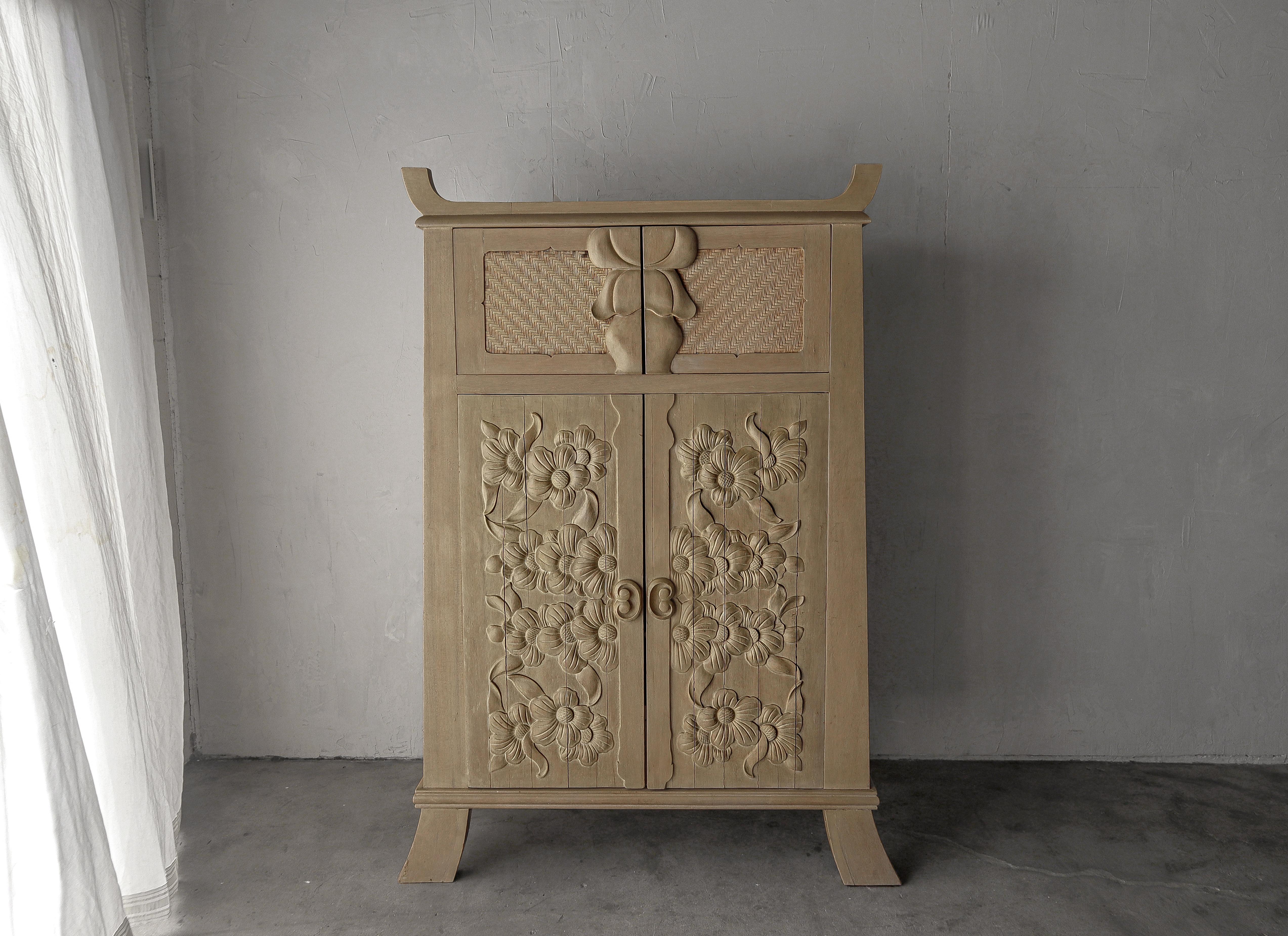 carved wood storage cabinet