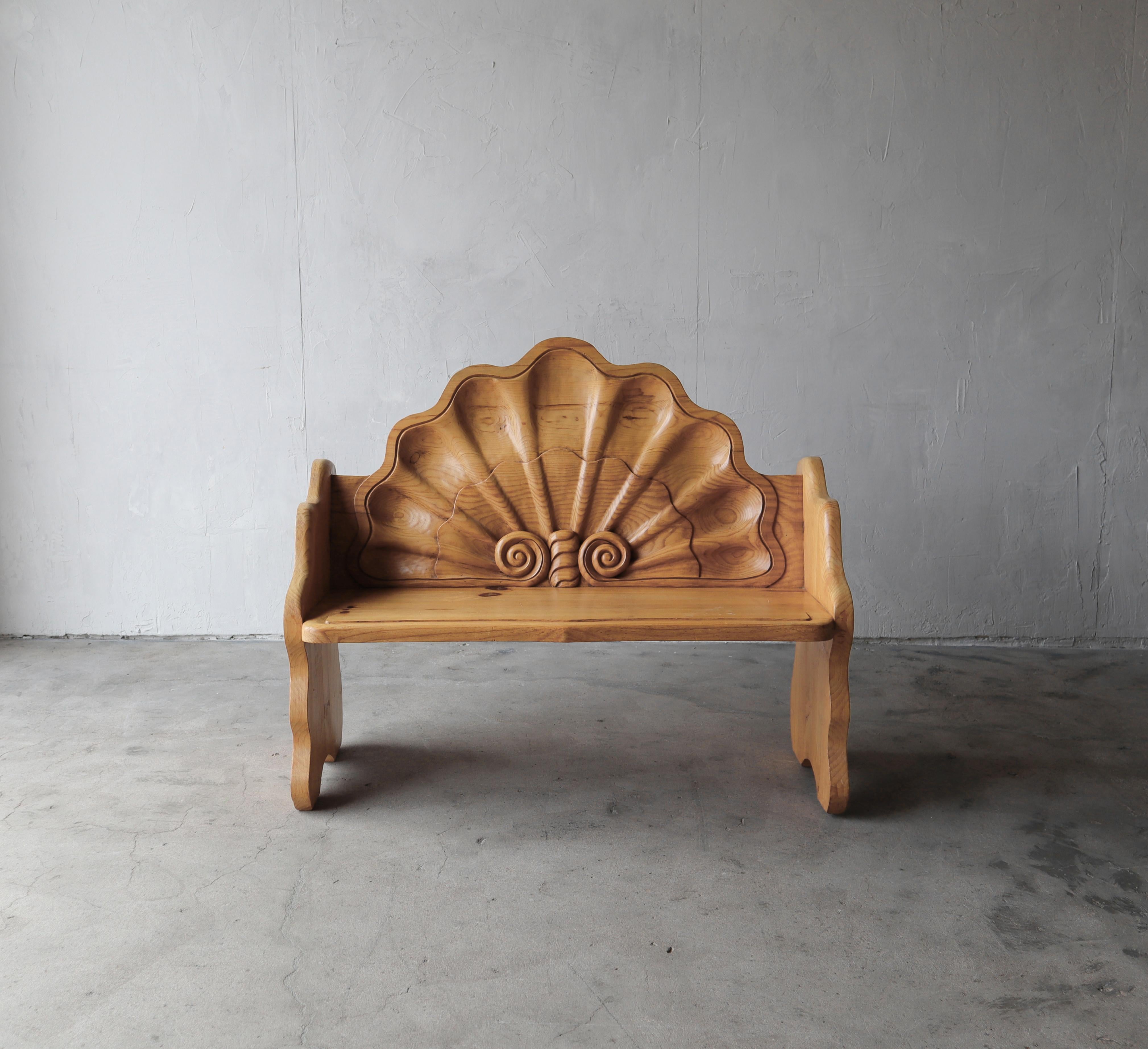 A true one of a kind piece, a conversation piece. Hand carved with no detail spared. If you're looking for a unique piece, something different, to put in a space that adds interest and function, look know further. This gorgeous bench is true art but
