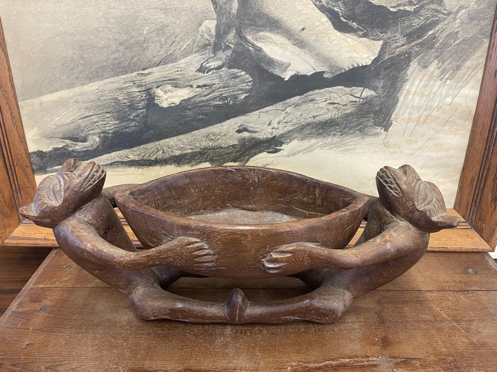 Possibly African Origin. Two Creature Figurines Wrap around the Bowl. Nice aging to the Wood creating a Gorgeous Patina. Hand Crafted using Solid Wood. Vintage Condition Consistent with Age as Pictured.

Dimensions. 16 W ; 5 1/2 D ; 7 H