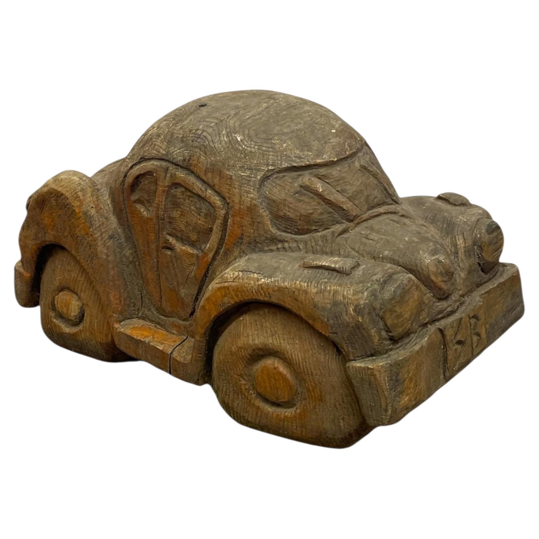 Vintage Hand Carved Wooden Car sculpture in the Style of a Volkswagen Beetle
