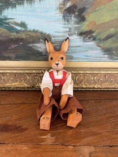 Vintage Hand-Carved Wooden Rabbit Doll with Articulated Limbs.