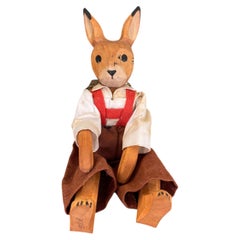 Vintage Hand-Carved Wooden Rabbit Doll with Articulated Limbs.