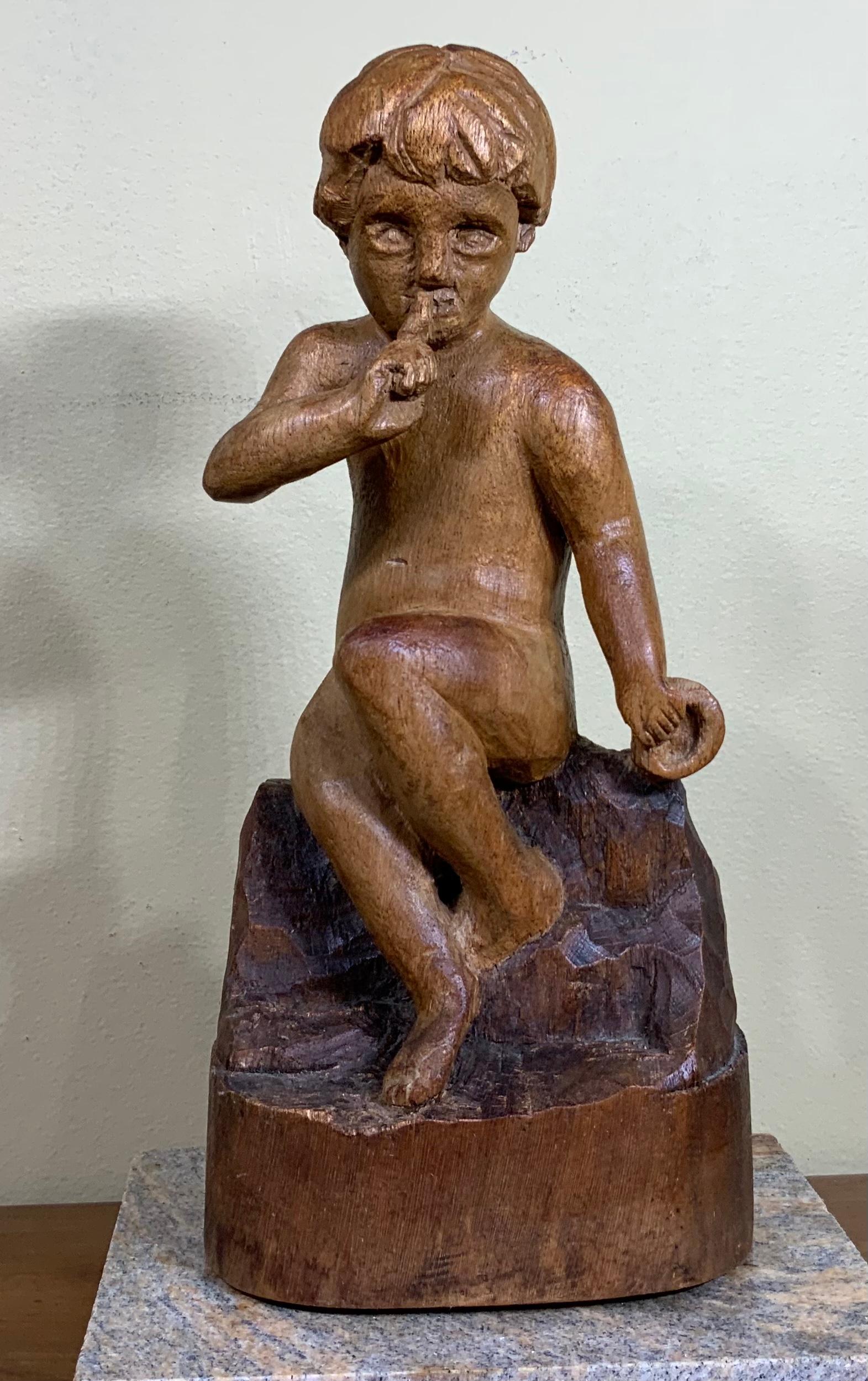 Beautiful fine hand carving made of walnut wood of a sitting kid with intriguing facial expression, pointing finger to the mouth with the expression Quiet !!!.
Mounted on a granite base (include). Sigh in the back by the artist P.H
Base size: 7” x
