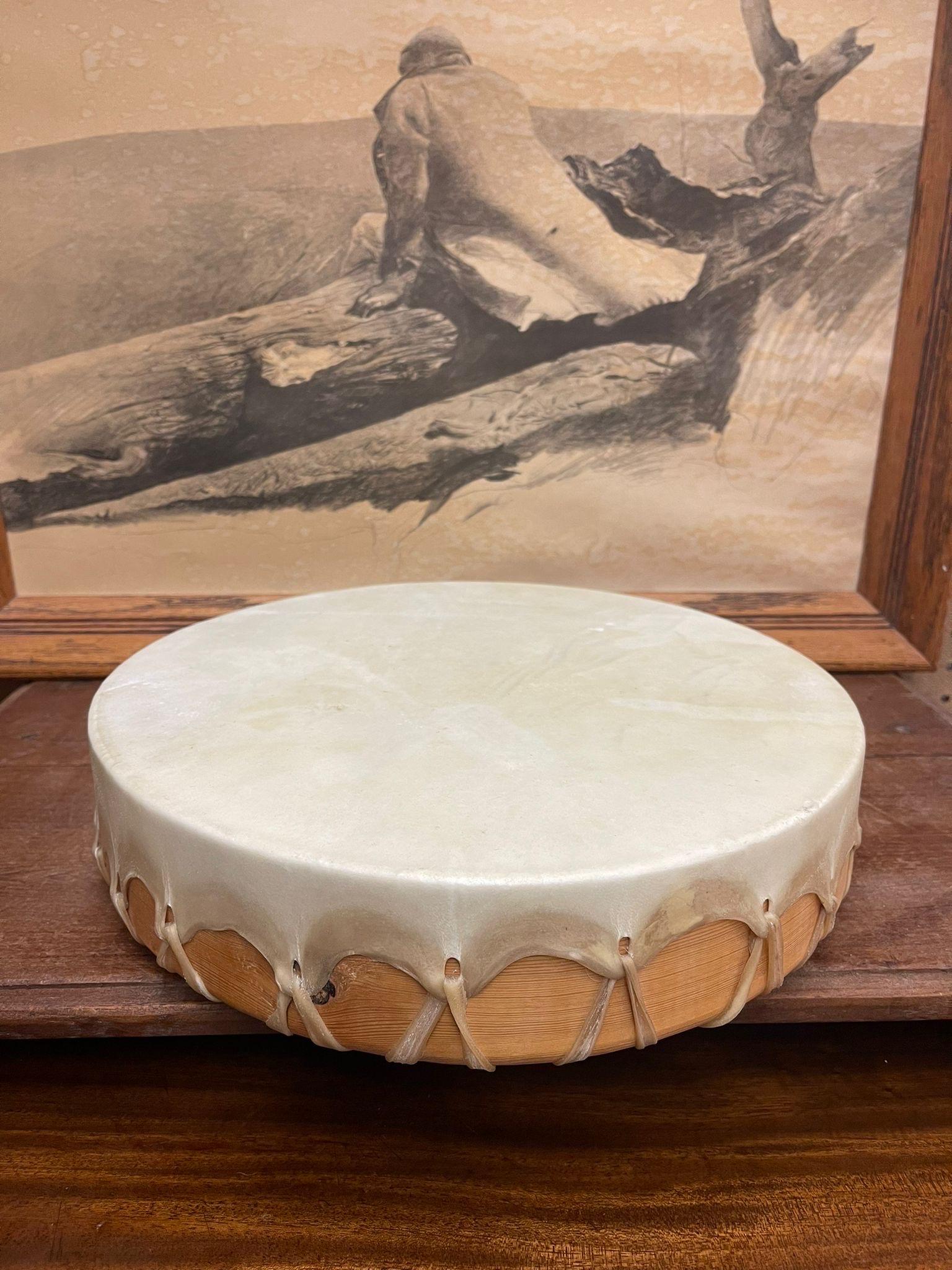 Possibly Rawhide as the Stretched Fabric on Top of Drum. Five Direction Handles. Intricate Knotting at the Bottom to Secure the Top Fabric.Possibly Native American Origin. Vintage Condition Consistent with Age as Pictured.

Dimensions. 14 Diameter;