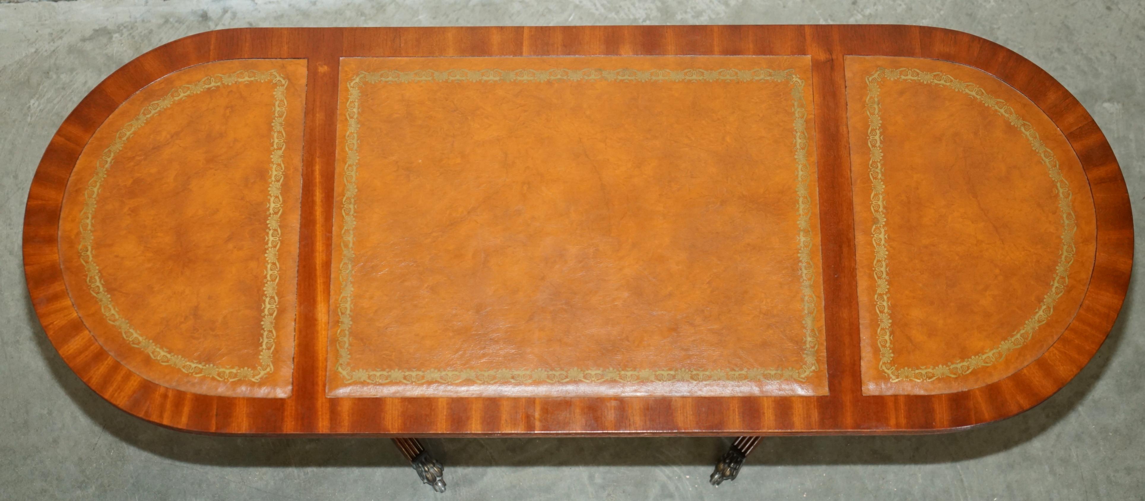 ViNTAGE HAND DYED AND AGED BROWN LEATHER OVAL COFFEE TABLE WITH LION CASTORS For Sale 10