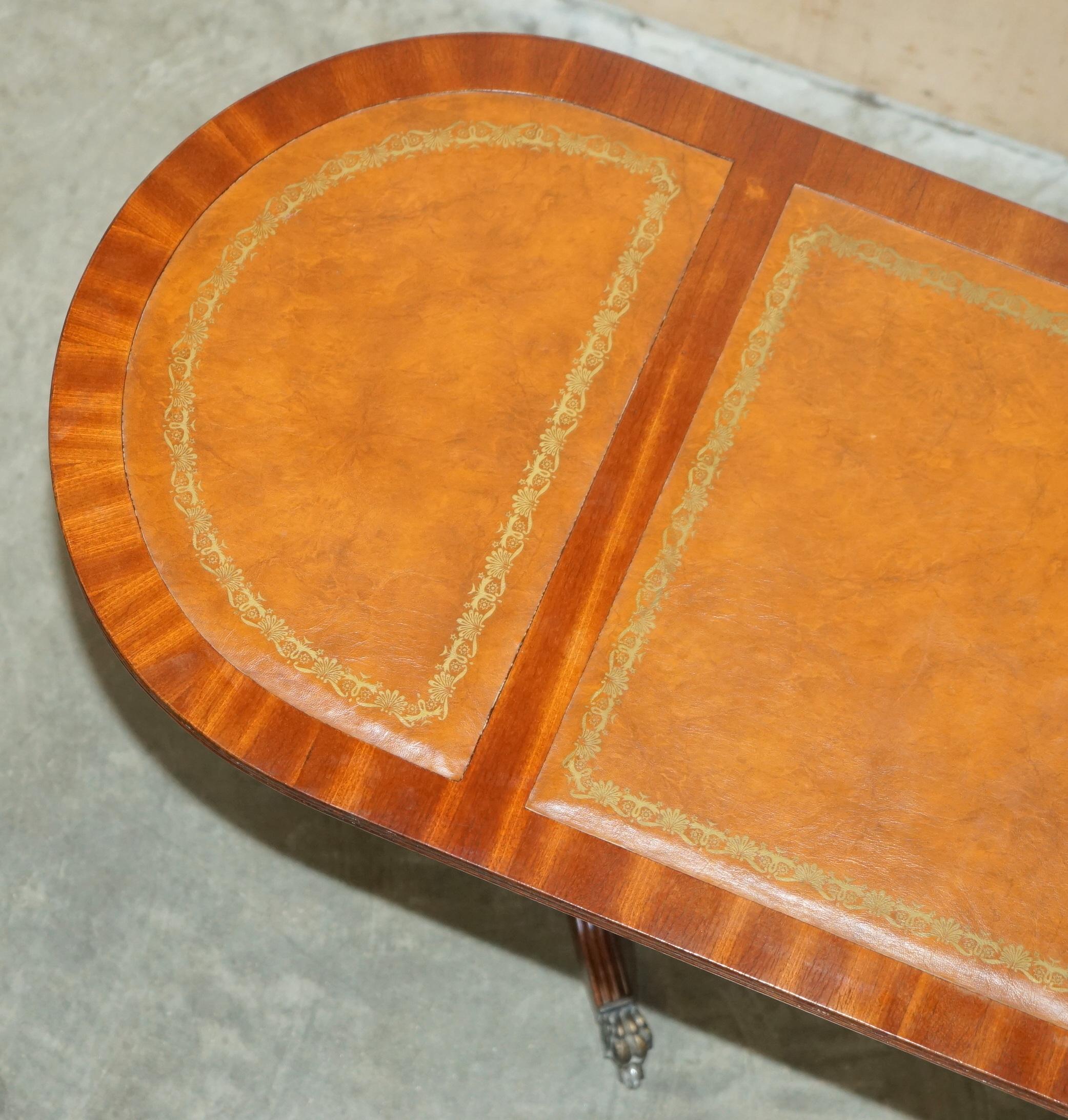 ViNTAGE HAND DYED AND AGED BROWN LEATHER OVAL COFFEE TABLE WITH LION CASTORS For Sale 11