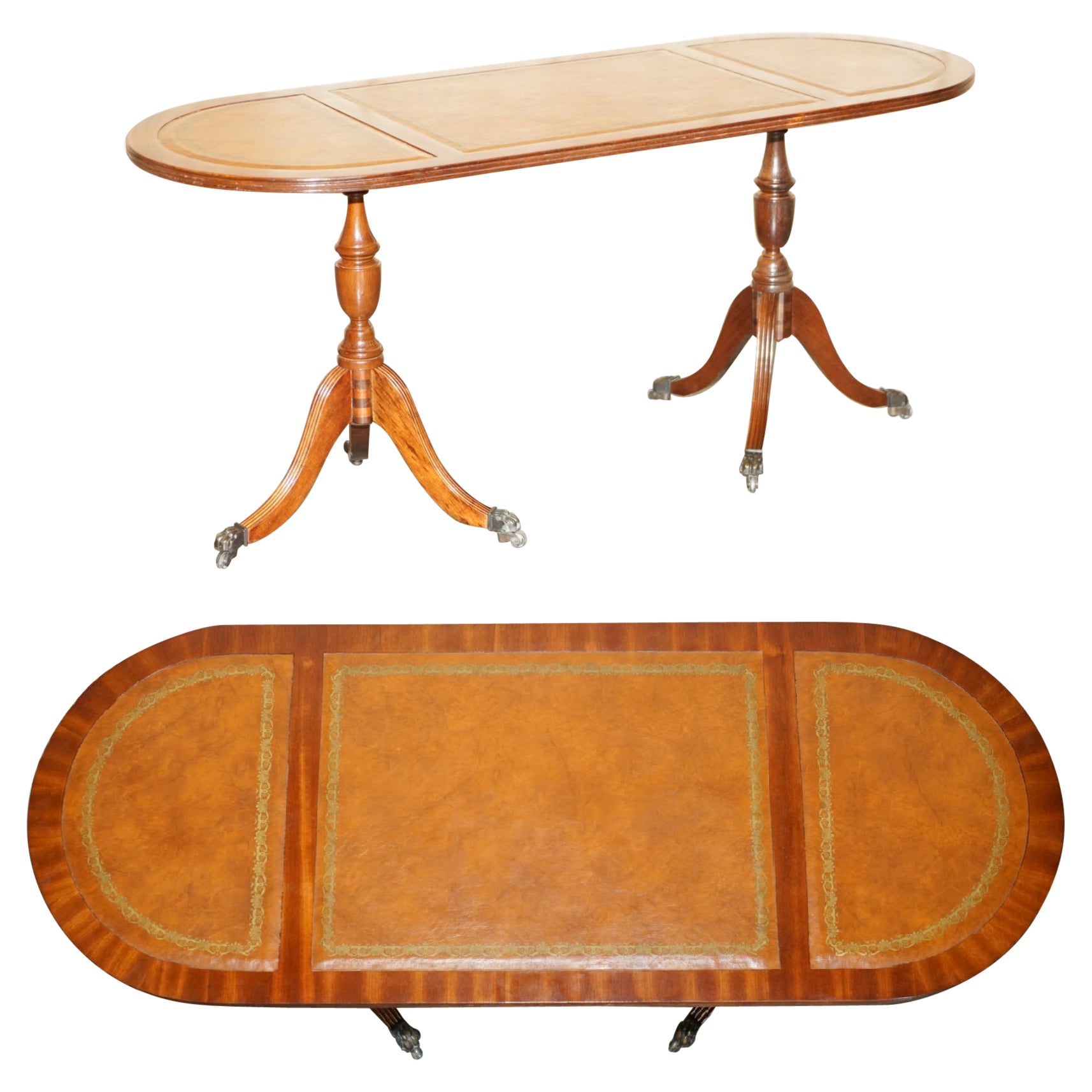 ViNTAGE HAND DYED AND AGED BROWN LEATHER OVAL COFFEE TABLE WITH LION CASTORS