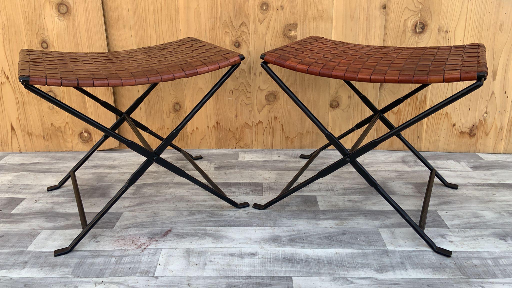 Vintage Hand Forged Wrought-Iron and Woven Leather Folding Stool - Pair 

Gorgeous vintage hand forged wrought-iron folding stools with hand woven Italian full grain leather. Solid construction and functional that would be a perfect addition to
