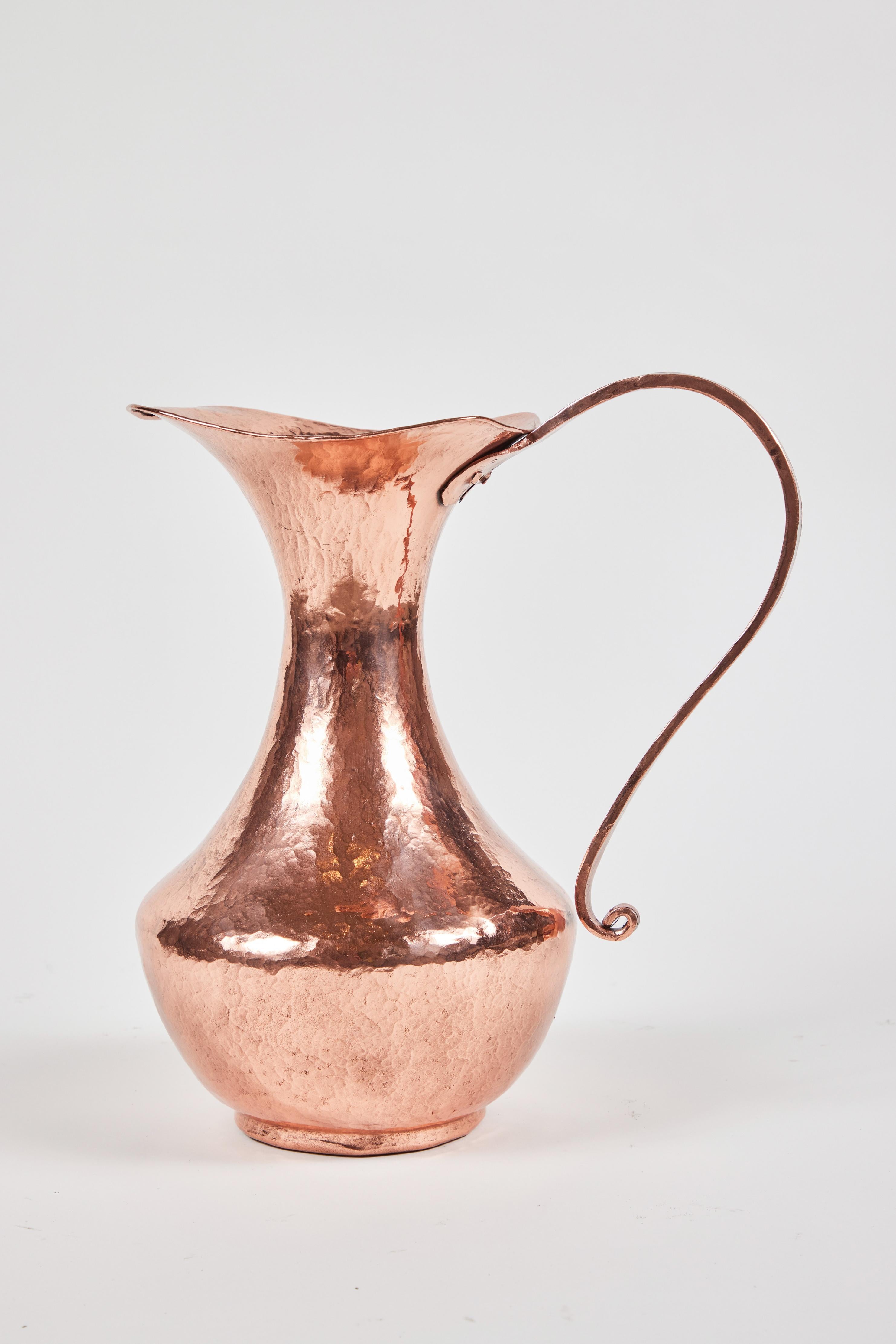 Vintage hand hammered copper pitcher, newly polished.