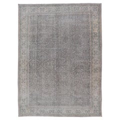 Vintage Hand-Knotted Distressed Turkish Rug in Wool with All-Over Floral Pattern