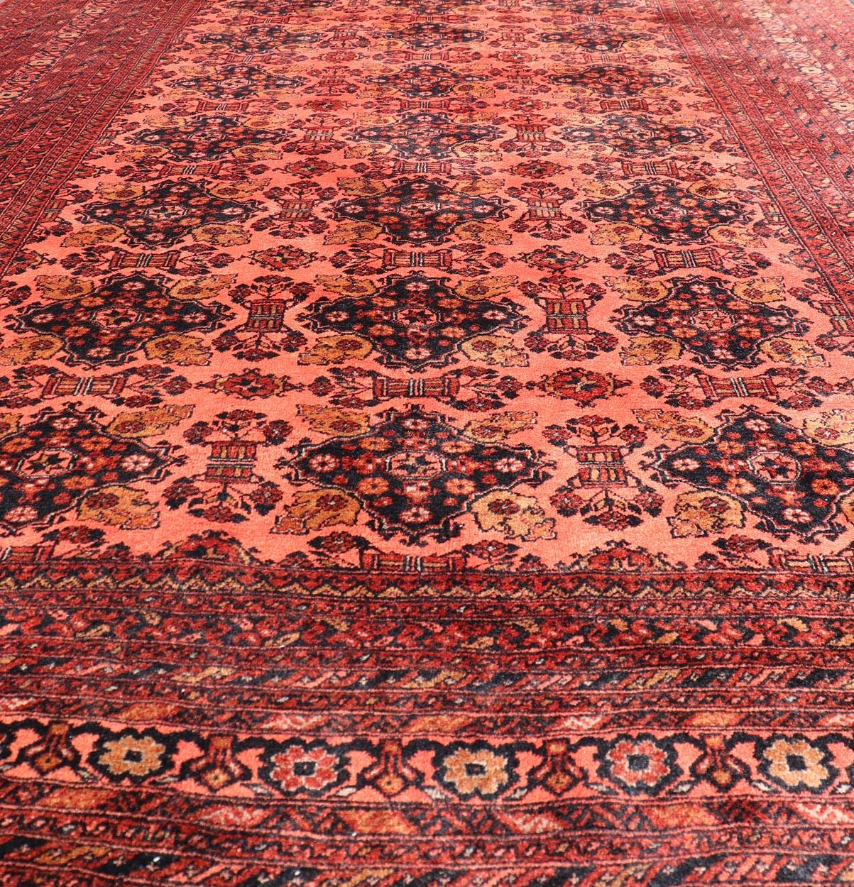 Vintage Hand Knotted Tukomen Ersari Rug in Red Background With Gul Design For Sale 2