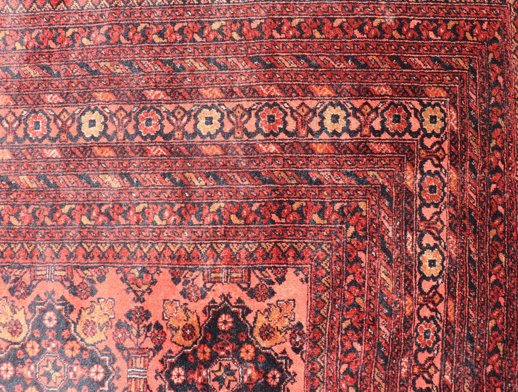 Vintage Hand Knotted Tukomen Ersari Rug in Red Background With Gul Design For Sale 4