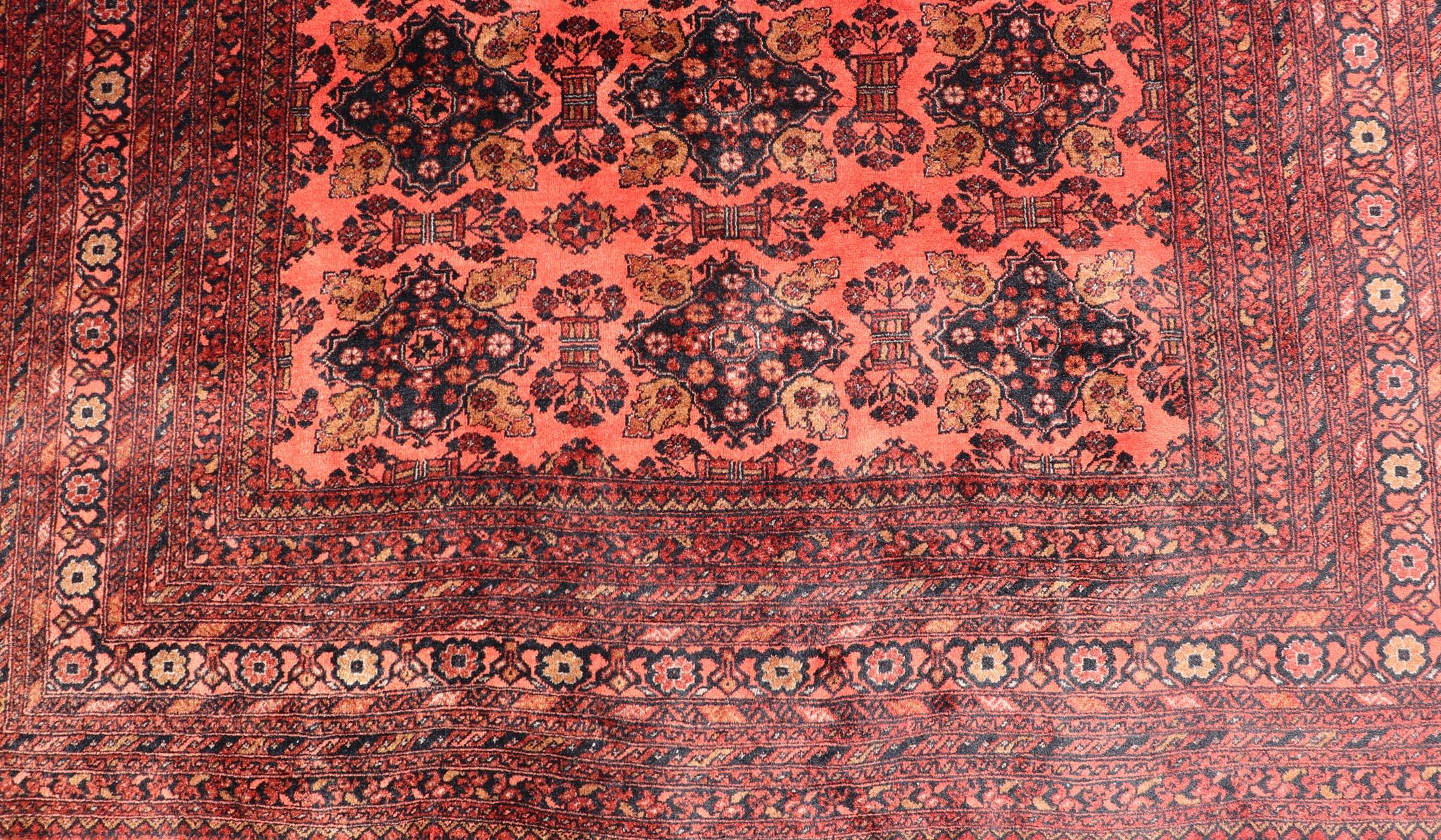 Measures: 6'8 x 9'5.

Vintage Hand Knotted Tukomen Ersari Rug in Red Background With Gul Design. Keivan Woven Arts; rug W22-0207, country of origin / type: Turkestan / Ersari, circa 1950s. Vintage Ersari

This Ersari rug has been hand-knotted in the