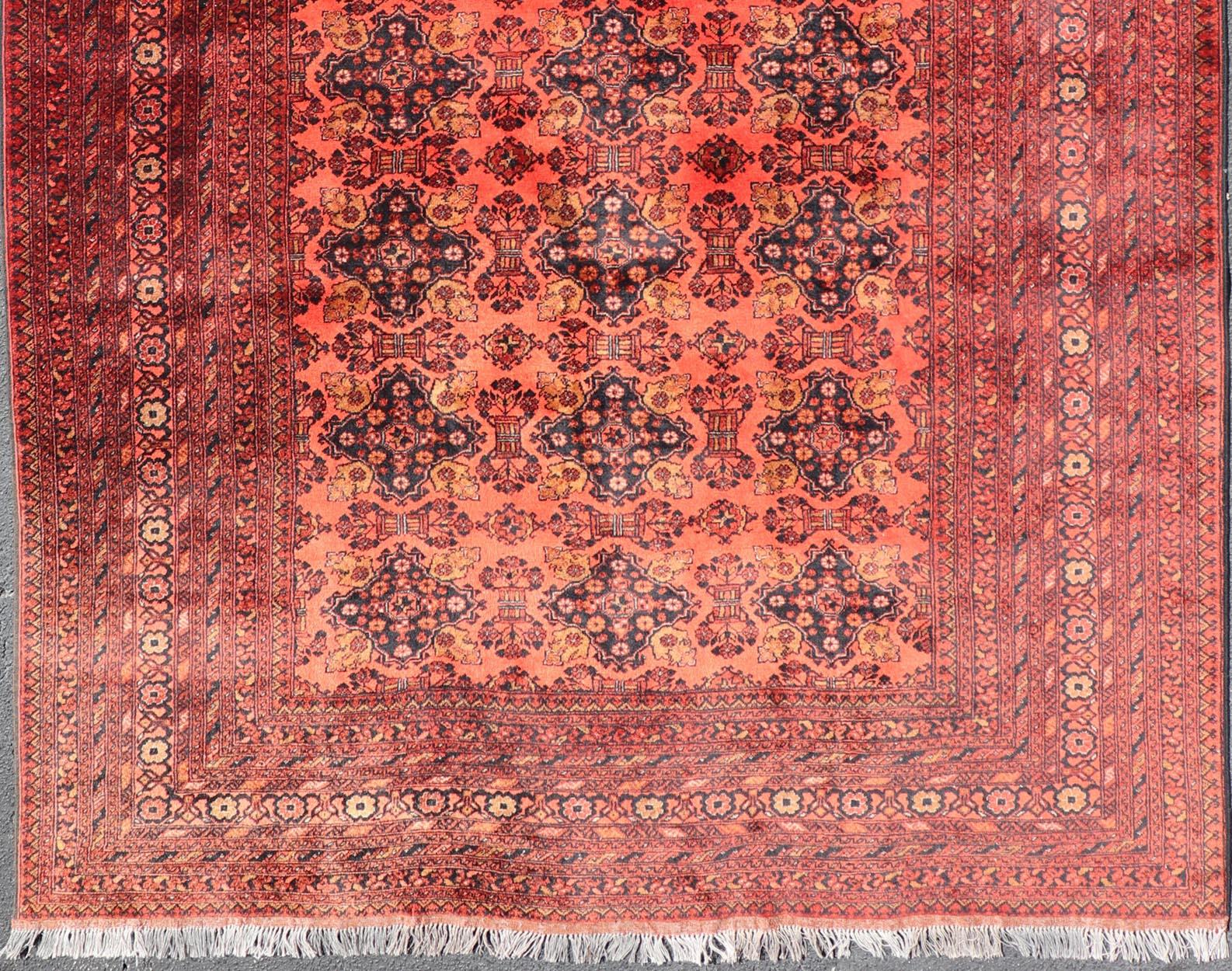 Vintage Hand Knotted Tukomen Ersari Rug in Red Background With Gul Design In Excellent Condition For Sale In Atlanta, GA
