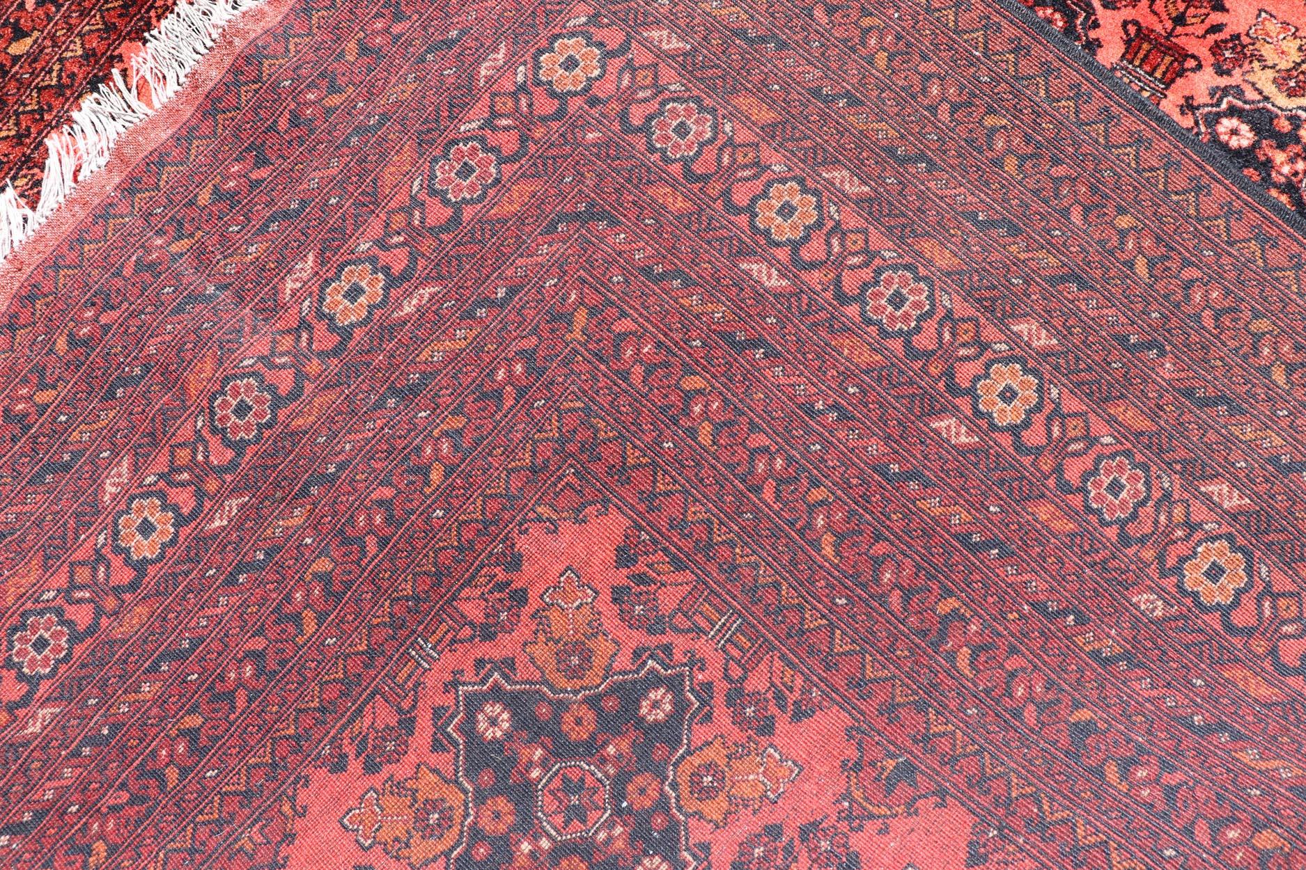 20th Century Vintage Hand Knotted Tukomen Ersari Rug in Red Background With Gul Design For Sale
