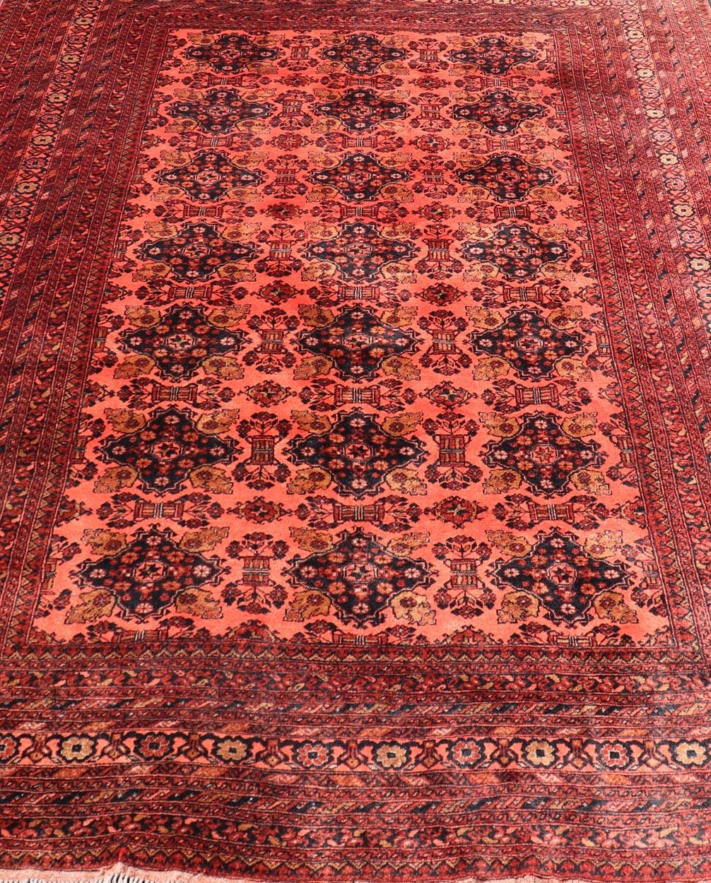 Vintage Hand Knotted Tukomen Ersari Rug in Red Background With Gul Design For Sale 1