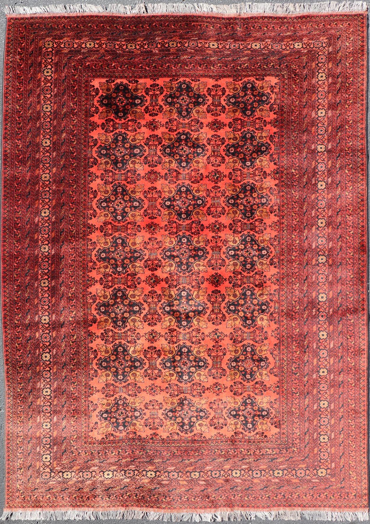 Vintage Hand Knotted Tukomen Ersari Rug in Red Background With Gul Design For Sale