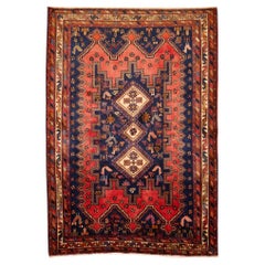 Tapis oriental vintage noué à la main à motifs tribaux rouges et bleus