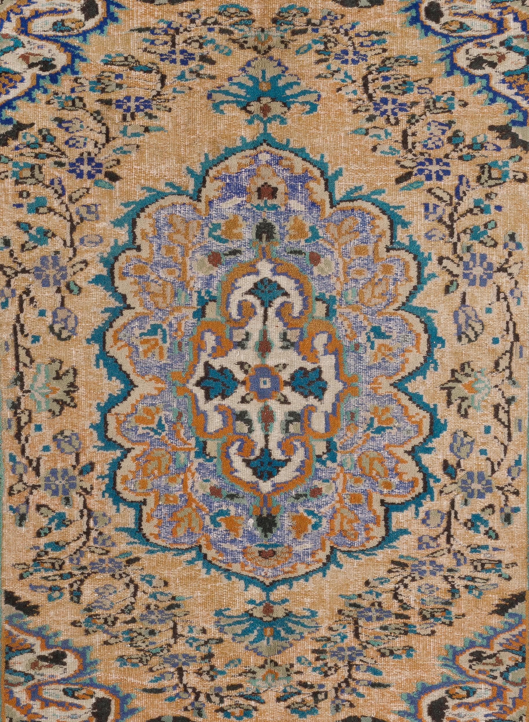 A vintage hand knotted Turkish rug from the 1960s featuring a round polygonal medallion filled with floral motifs. The medallion is surrounded all around with an abundance of flowering vines drawn in detail, conveying a sense of smooth, delicate