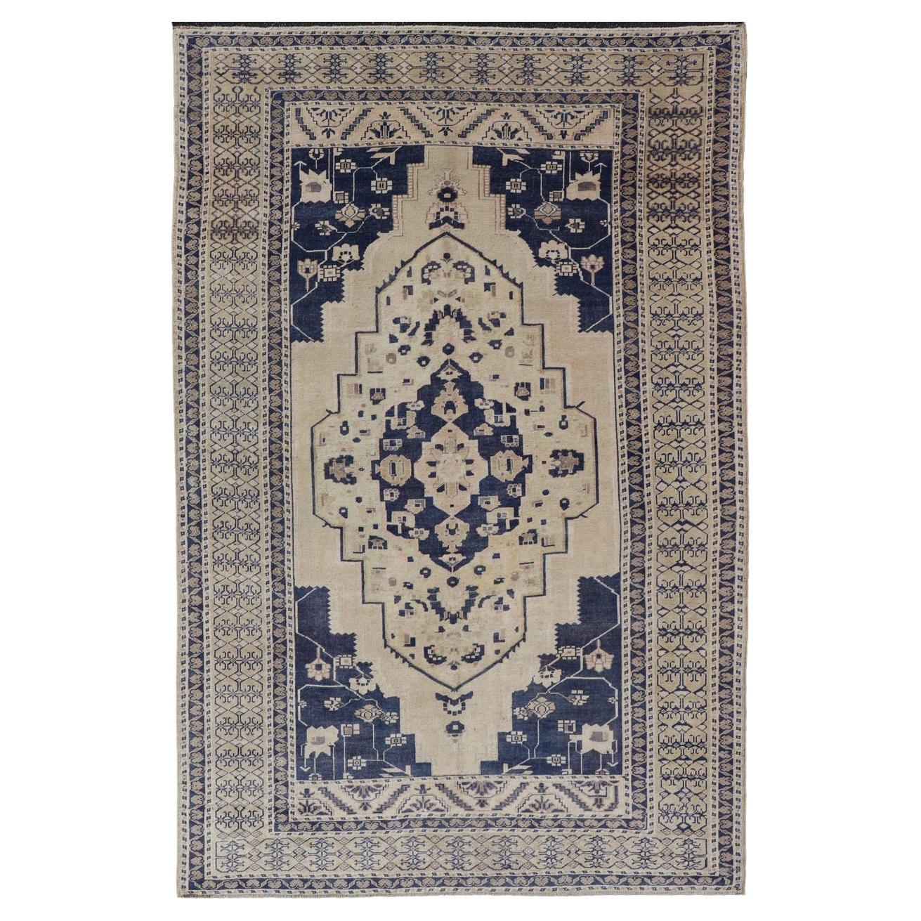 Vintage Hand-Knotted Turkish Oushak in Wool with Sub-Geometric Medallion Design