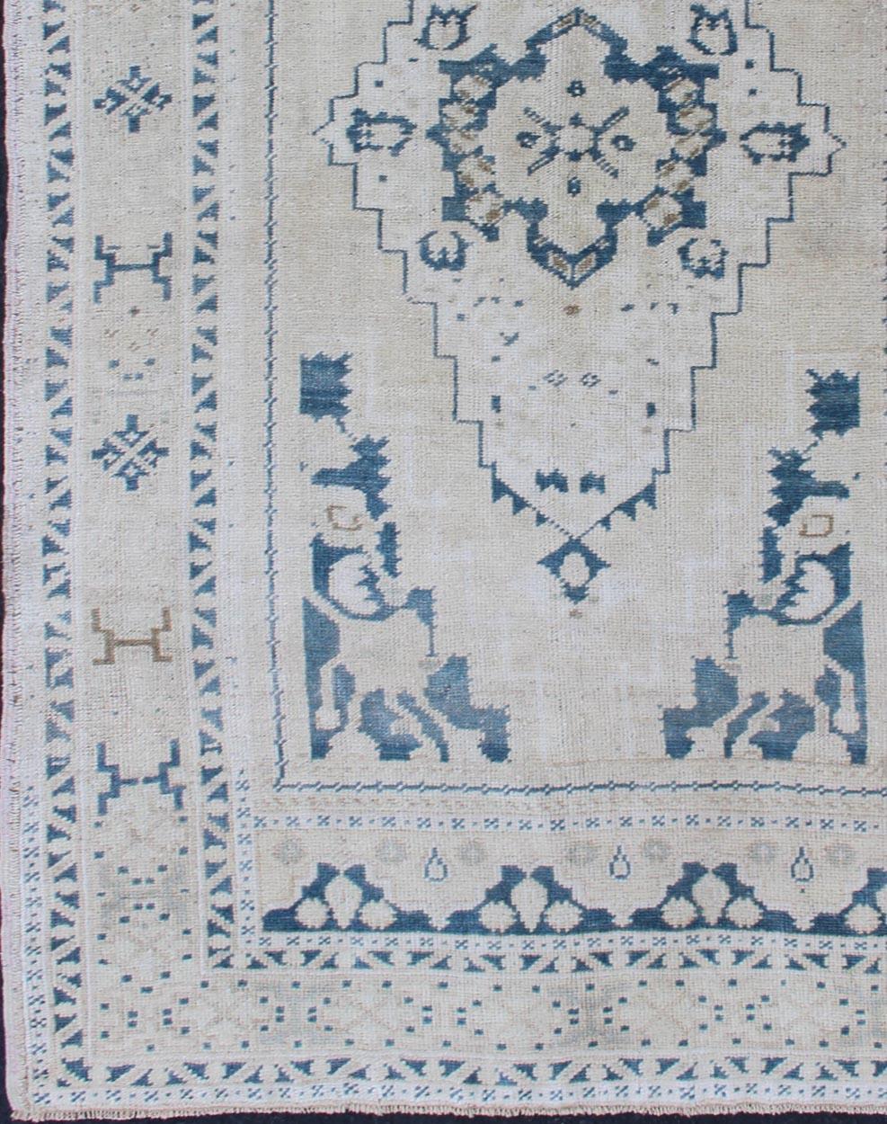 Hand-Knotted Vintage Hand Knotted Turkish Oushak Rug with Central Medallion in Blue and Cream For Sale