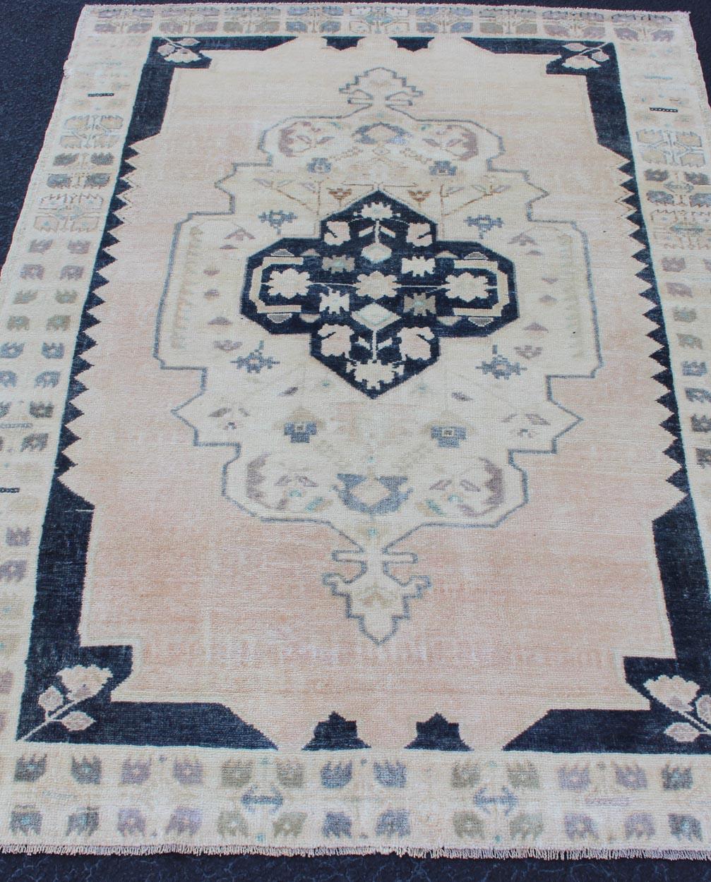 Wool Vintage Hand Knotted Turkish Oushak Rug with Central Medallion in Blue and Cream For Sale