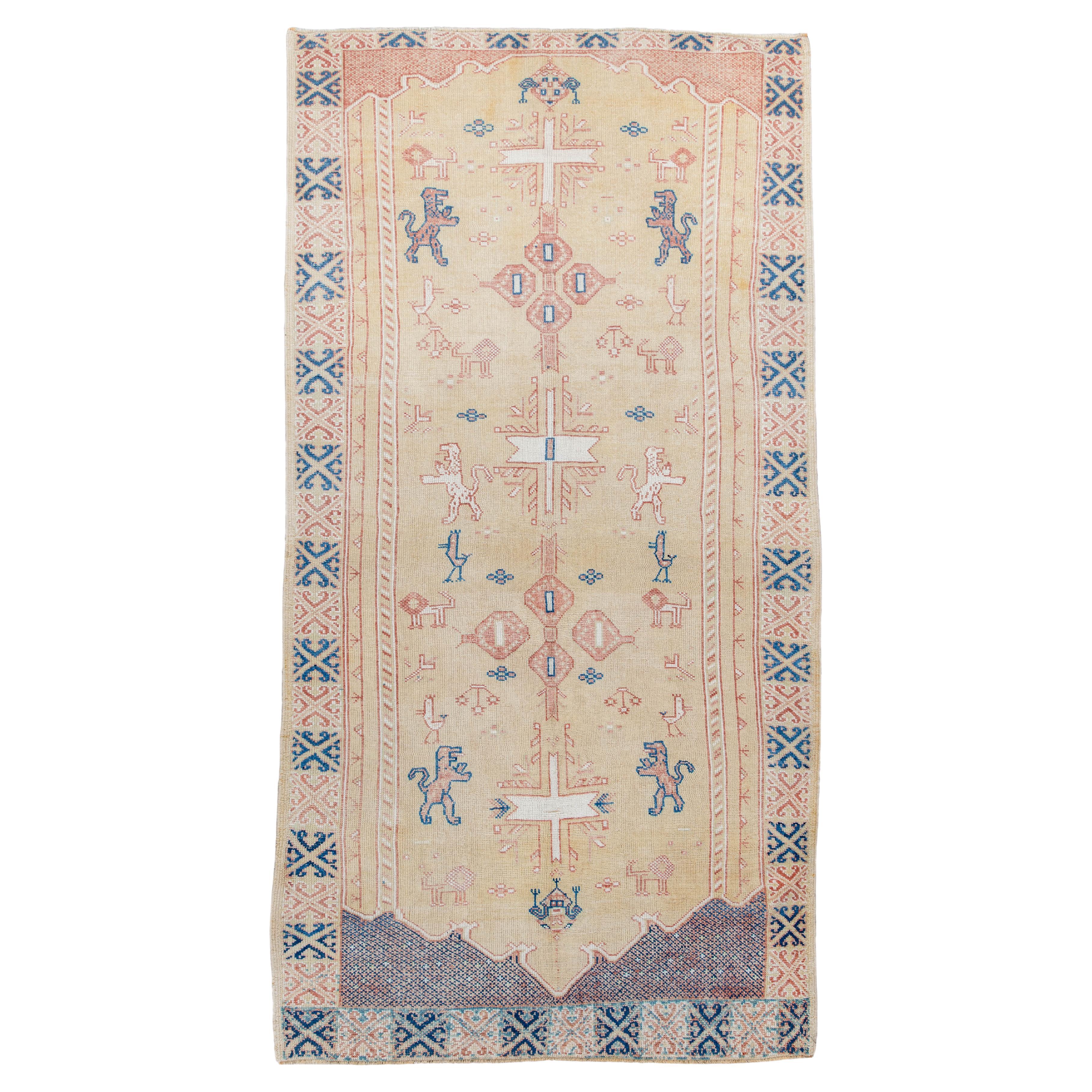 Vintage Hand-Knotted Turkish Rug Animal and Cross Motifs For Sale