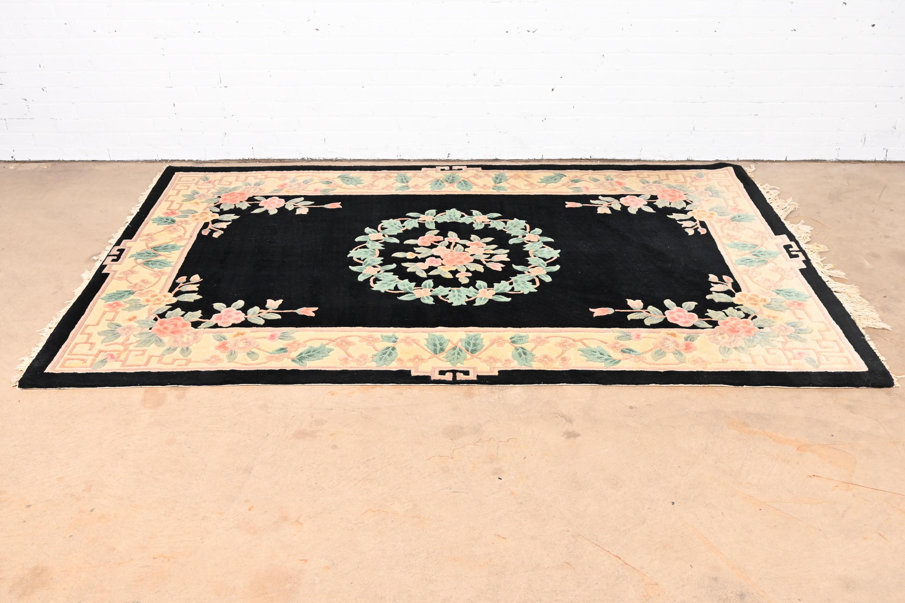 A beautiful hand made vintage Chinese sculpted wool area rug

China, Mid-20th Century

Nice floral design, with predominant colors in light green, peach, and black.

Measures: 63