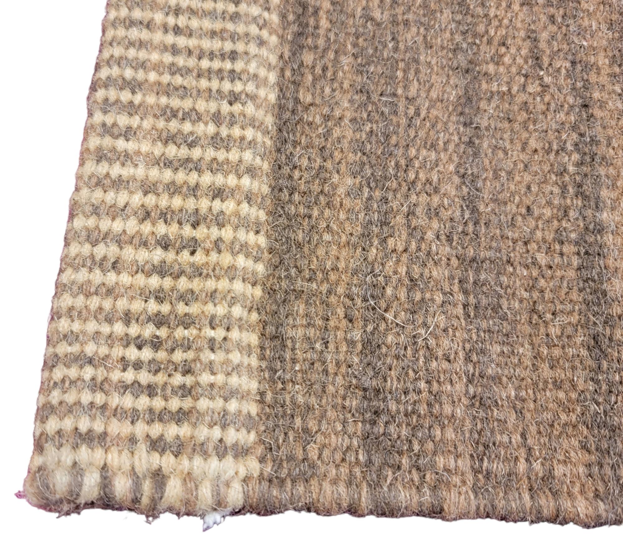 Hand Made Turkish Wool Rug wonderful color pallet. Striped and brown border. This Thick rug is strong and sturdy, very well made. Works well with modern and Scandinavian design.

- Measures approx. 92 long x 60 wide