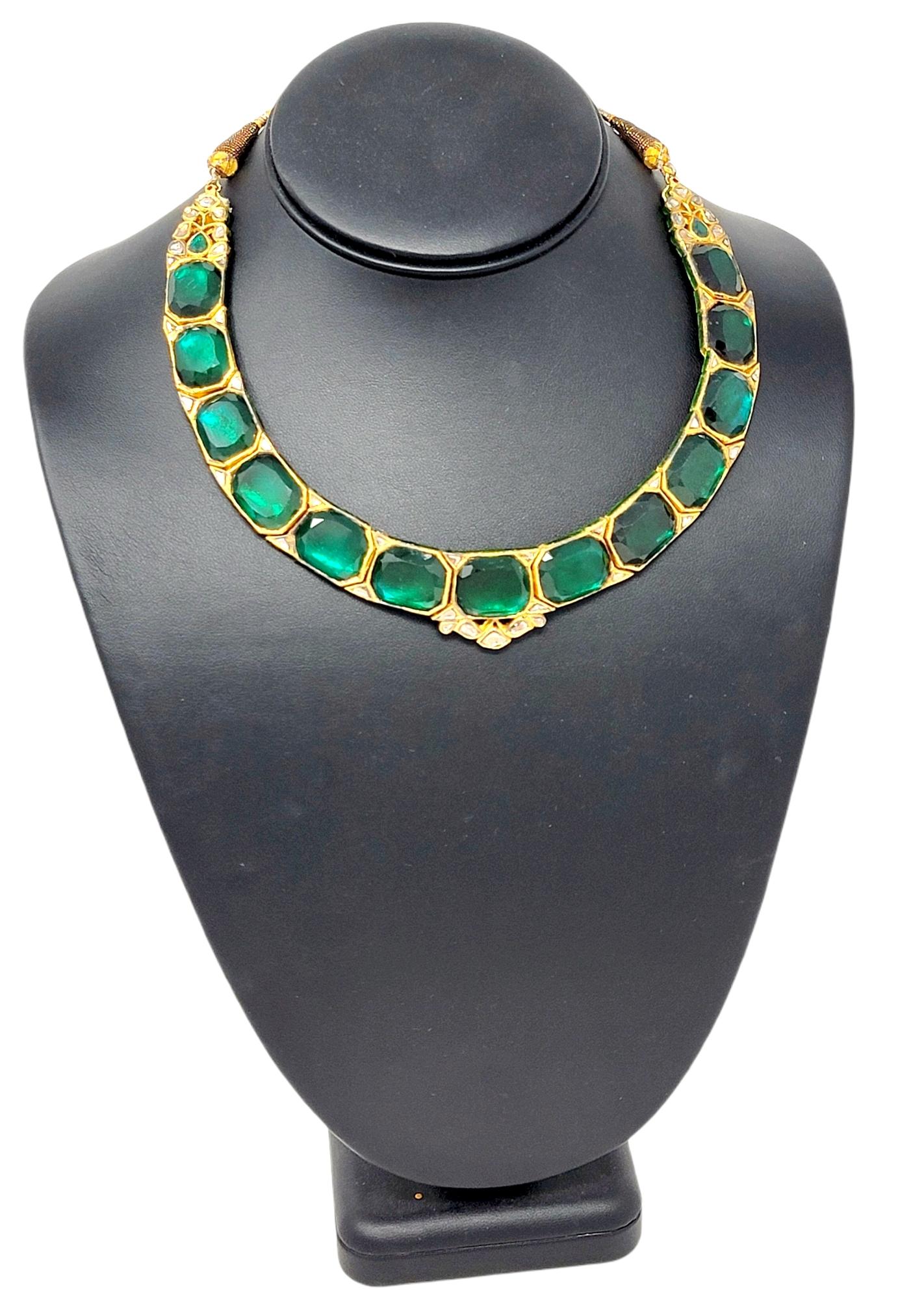 This gorgeous, one-of-a-kind Polki necklace is absolutely stunning. The bold color and size of the rich green glass stones really makes a statement, while the natural diamonds add an extra touch of sparkle. This incredible necklace features 13