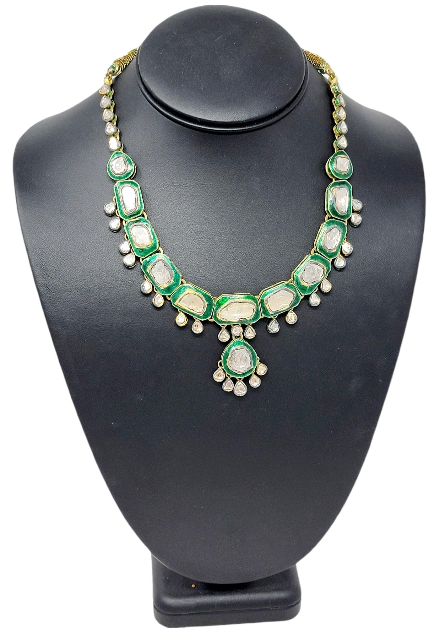 This stunning, one-of-a-kind Polki necklace is absolutely incredible. Bursting with sparkle from the sizeable diamonds, this piece also features bold color and a unique custom design. A single elegant row of uncut diamonds (H-J / SI-I1) bezel set in