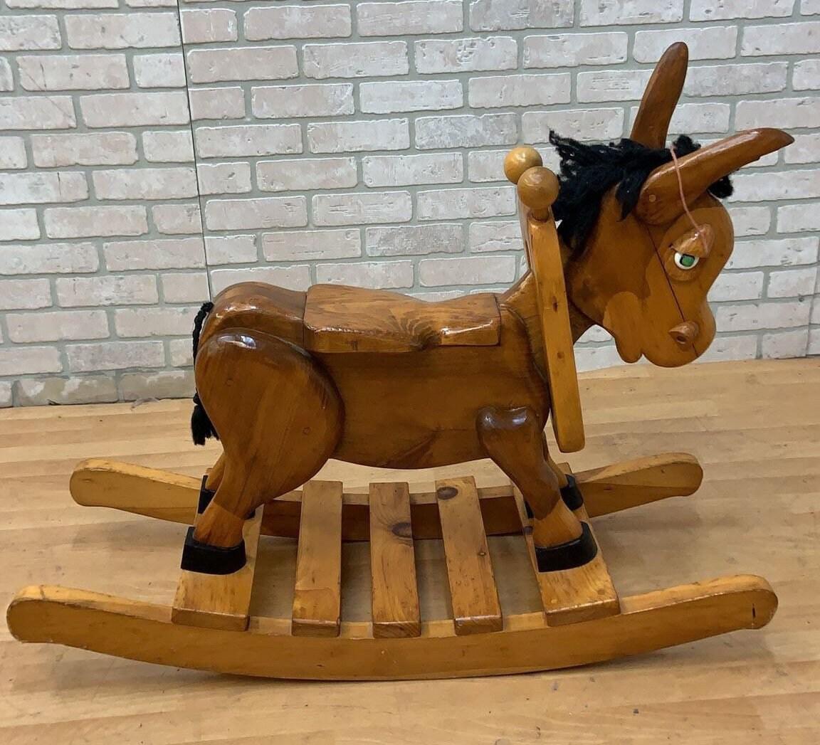 Vintage Hand Made Wood Carved Rocking Donkey

Rare, unique, and absolutely adorable hand made, solid wood carved vintage rocking donkey. The perfect classic vintage touch to complete your nursery.

Circa - 20th Century 

Dimensions
H: 30