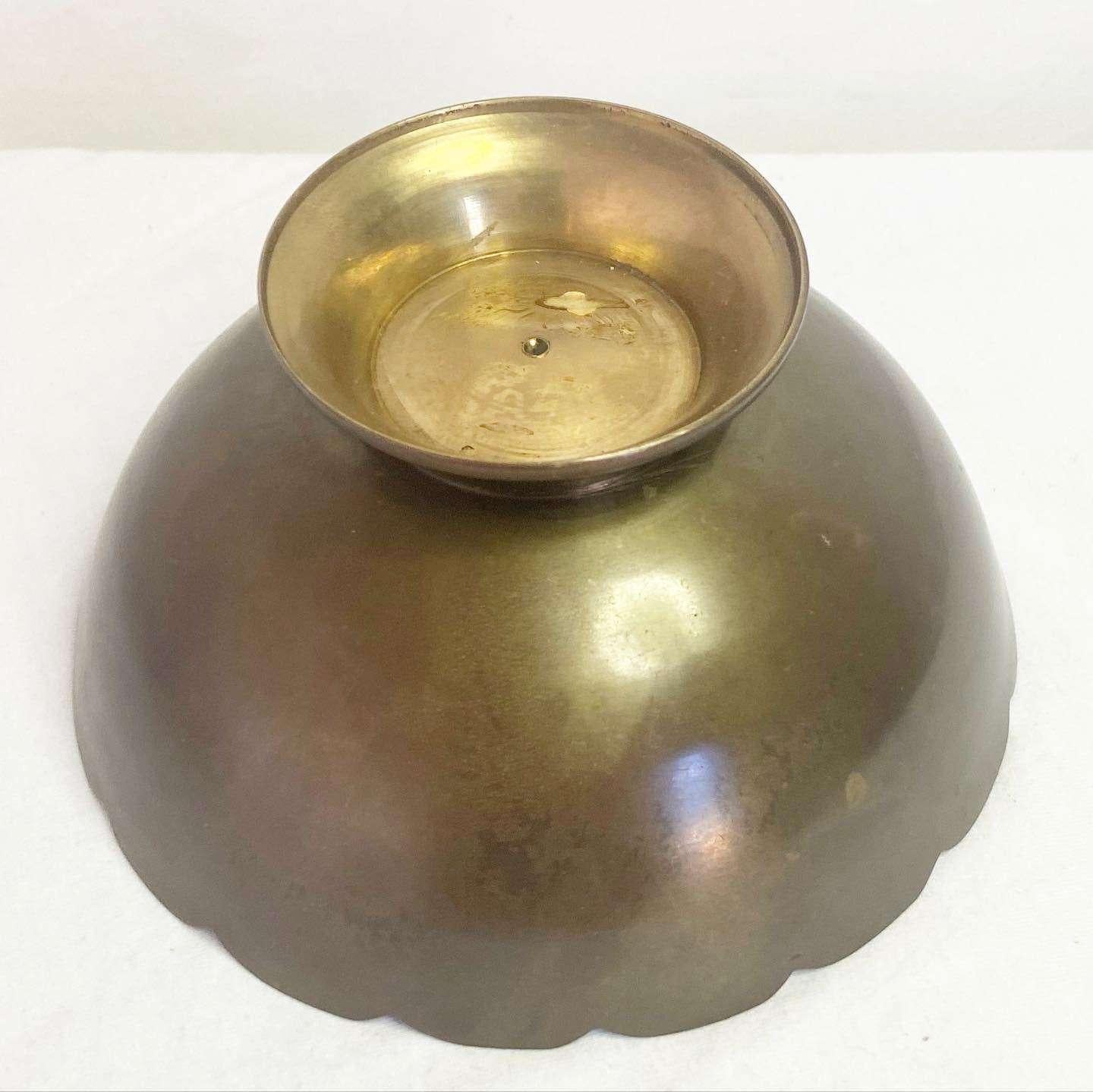 Stunning vintage brass bowl/catchall. Features a painted interior.
