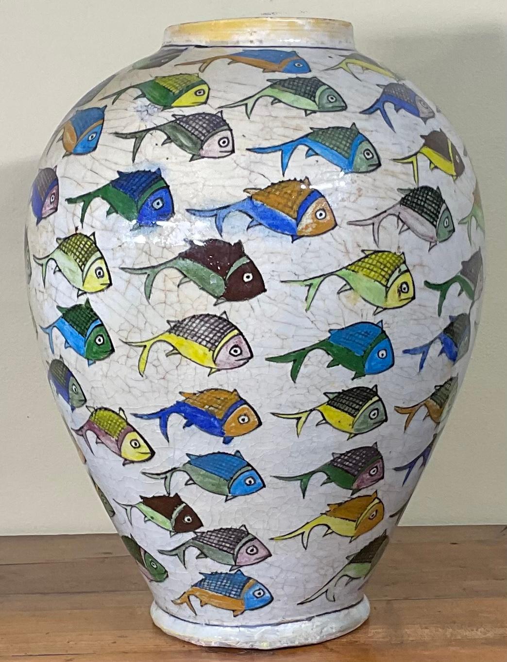 Beautiful Persian ceramic vase hand-painted and glazed with colorful fish motif surrounding on cream color background. Great object of art for display.