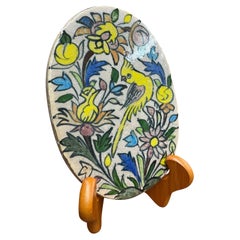 Vintage Hand gemalt Keramik ovale Fliese mit Papagei-Motiv.