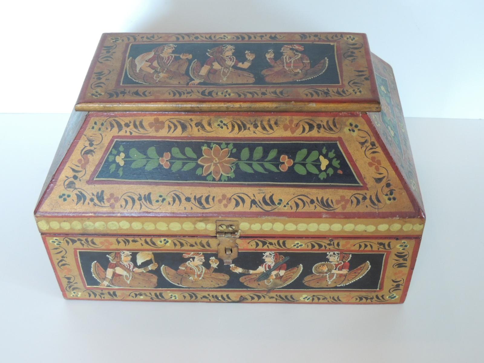 Vintage hand painted colorful Indian box with lid.
Depicting human figures and flowers, hand painted on wood.
Size: 12