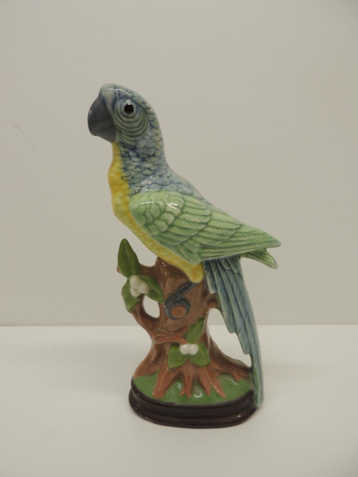 Chinese export ceramic parrot on tree trunk.
In shades of blue, green, yellow, brown and antique white.
Size: 2.5 x 5 x 10 H.