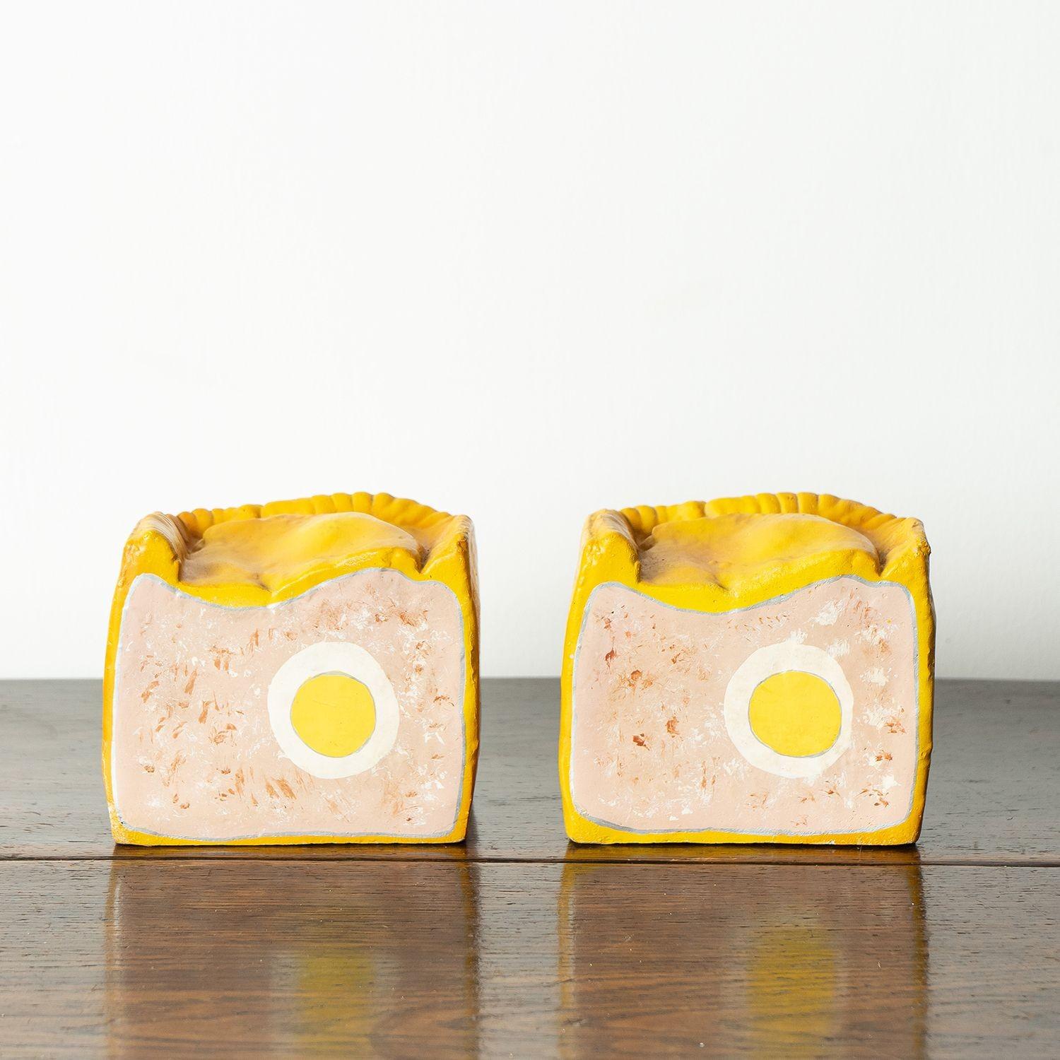 Midcentury shop display foods.
Originally made for and used for Electrolux refrigerator advertisements in the 1950s.
Three pieces in the form of a large pork pie with egg cut in half and a stack of six rashers of back bacon.
Made from cast rubber