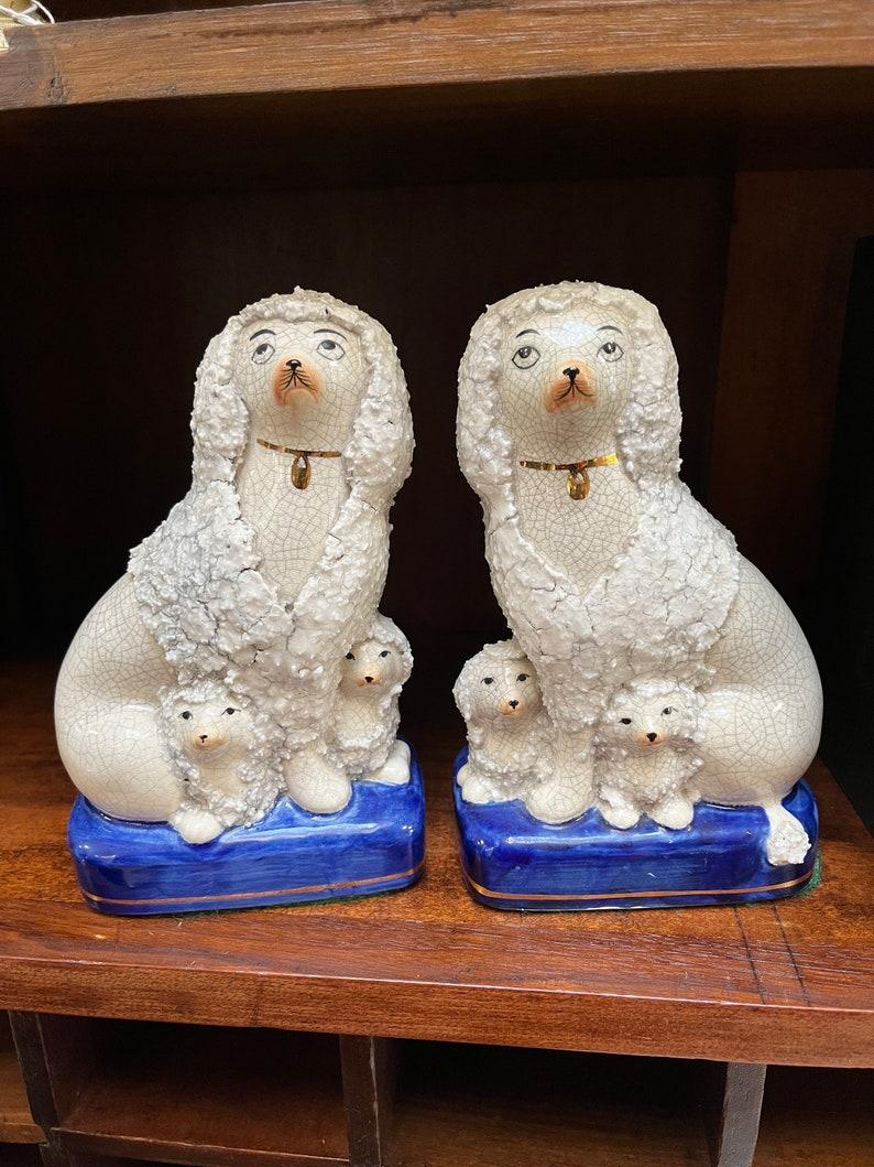 Meet your new favorite vintage find—this adorable pair of Fitz and Floyd Staffordshire-style Confetti Poodles with Puppies! 🐩💕 Inspired by the iconic Staffordshire dog sculptures that once graced elegant English homes, these charming poodles bring