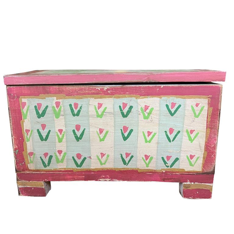 A decorative folk art hand-painted wood box with a hinged lid. A fabulous little box perfect for toy storage or small miscellaneous items. The top of the piece is hand-painted with the silhouette of a white cat with a pink bow. It is framed out with