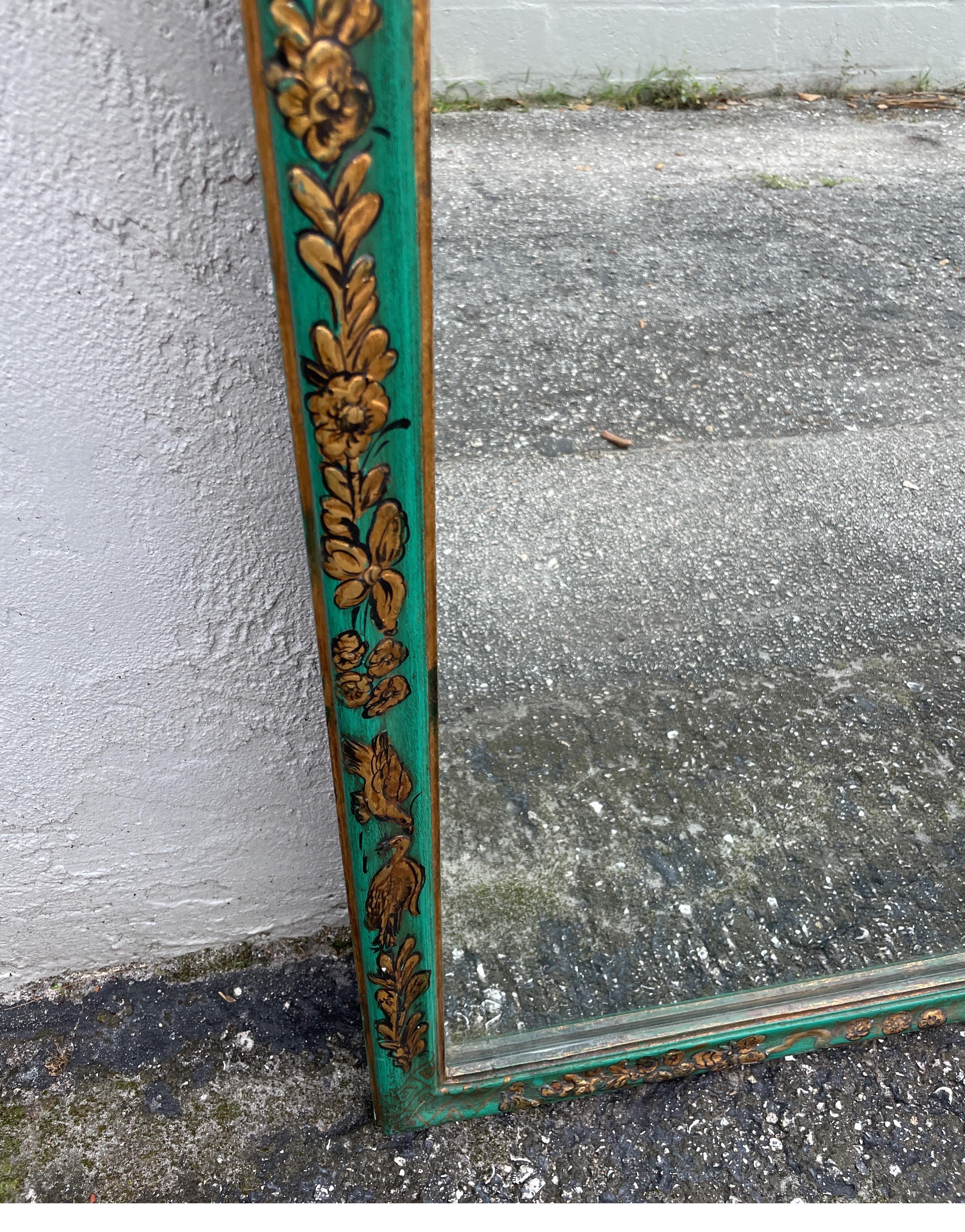 Vintage Italian hand painted chinoiserie mirror with a green background. Beautiful raised & gilded details of foliage, birds & butterflies.