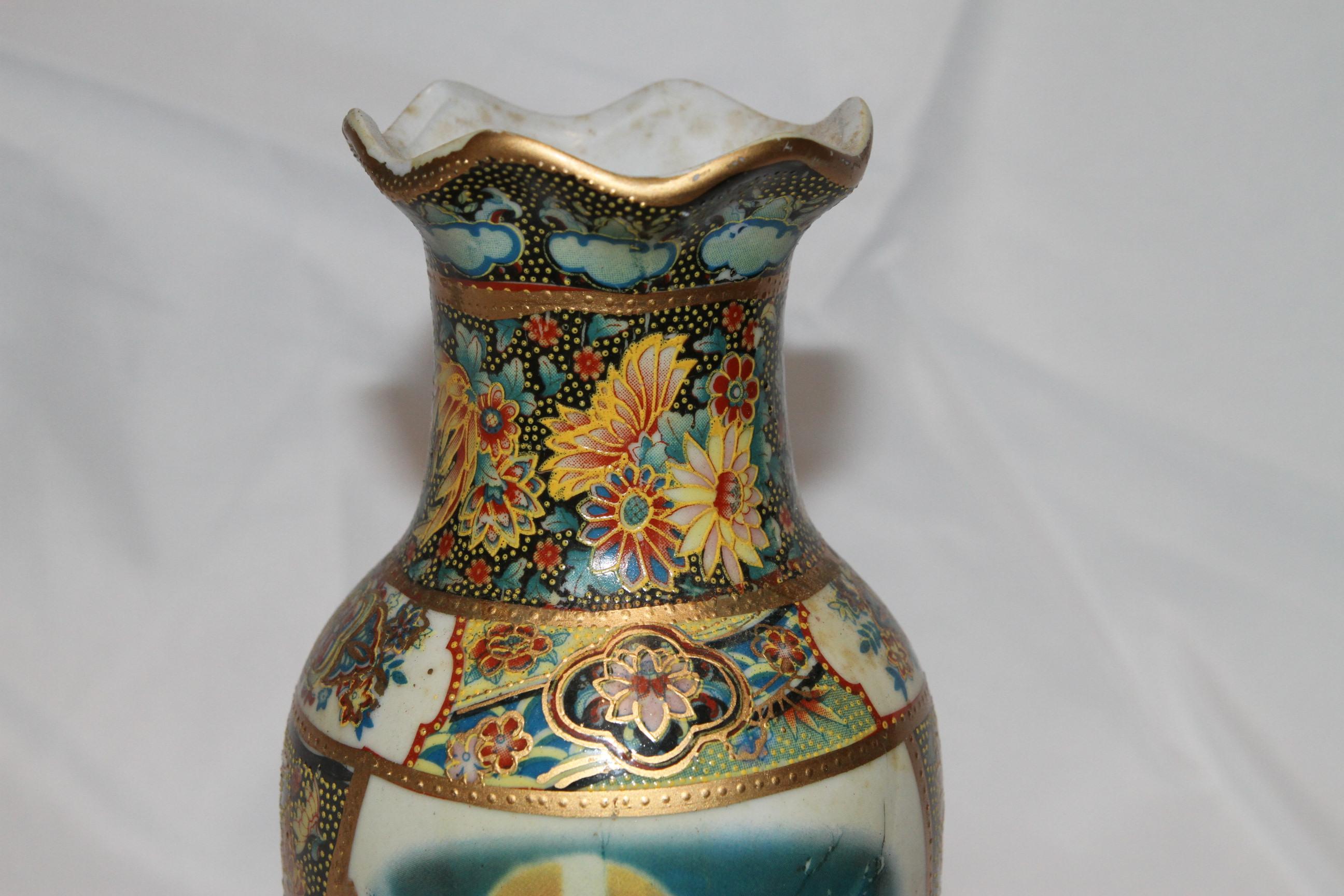 This is a hand-painted vase. The colors are vibrant. 