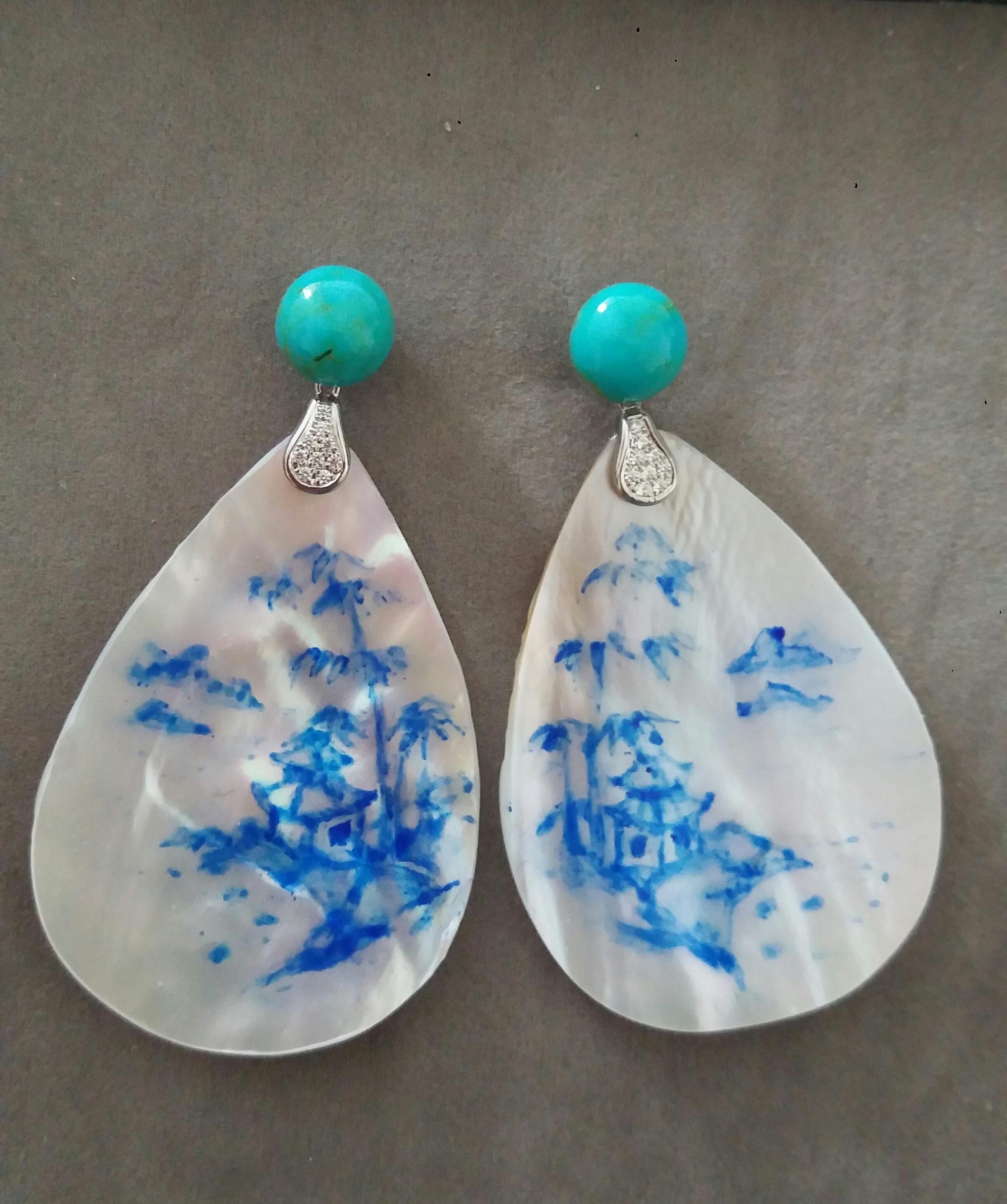Vintage pair of hand painted pear shape Mother of Pearls  measuring 40x55 mm depicting a landscape with a chinese style house near bamboo canes and mountains in the distant background ,suspended from 2 Turquoise buttons 10 mm  by 2 elements in 14 K