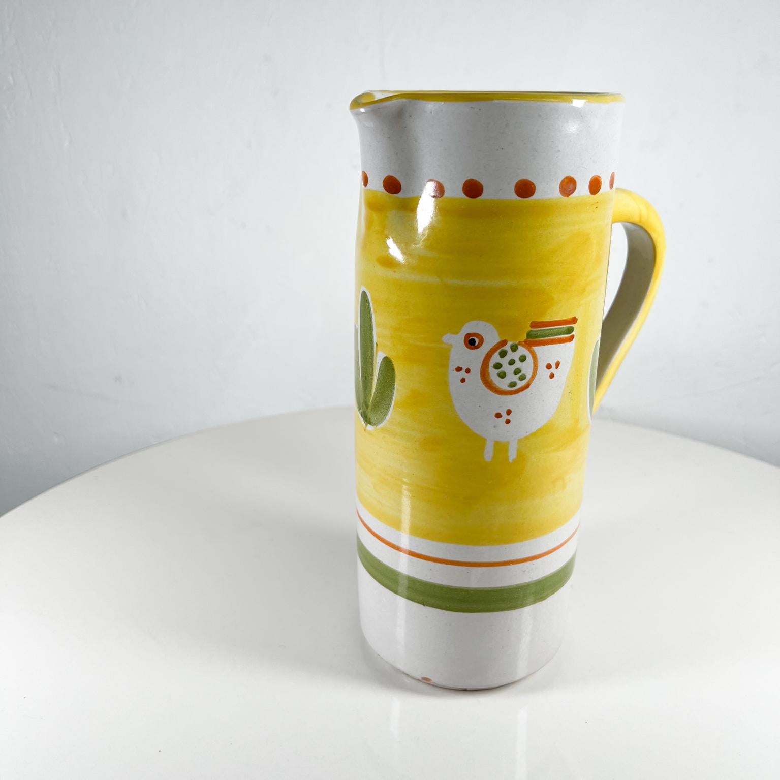 Vintage Chicken Design Hand Painted Yellow Green Pitcher Italy
Made in Italy
Attributed to Solimene Vietri 
7 deoth x 4 width x 9.75 tall
Original vintage condition, vintage wear is visible.
Refer to all images.