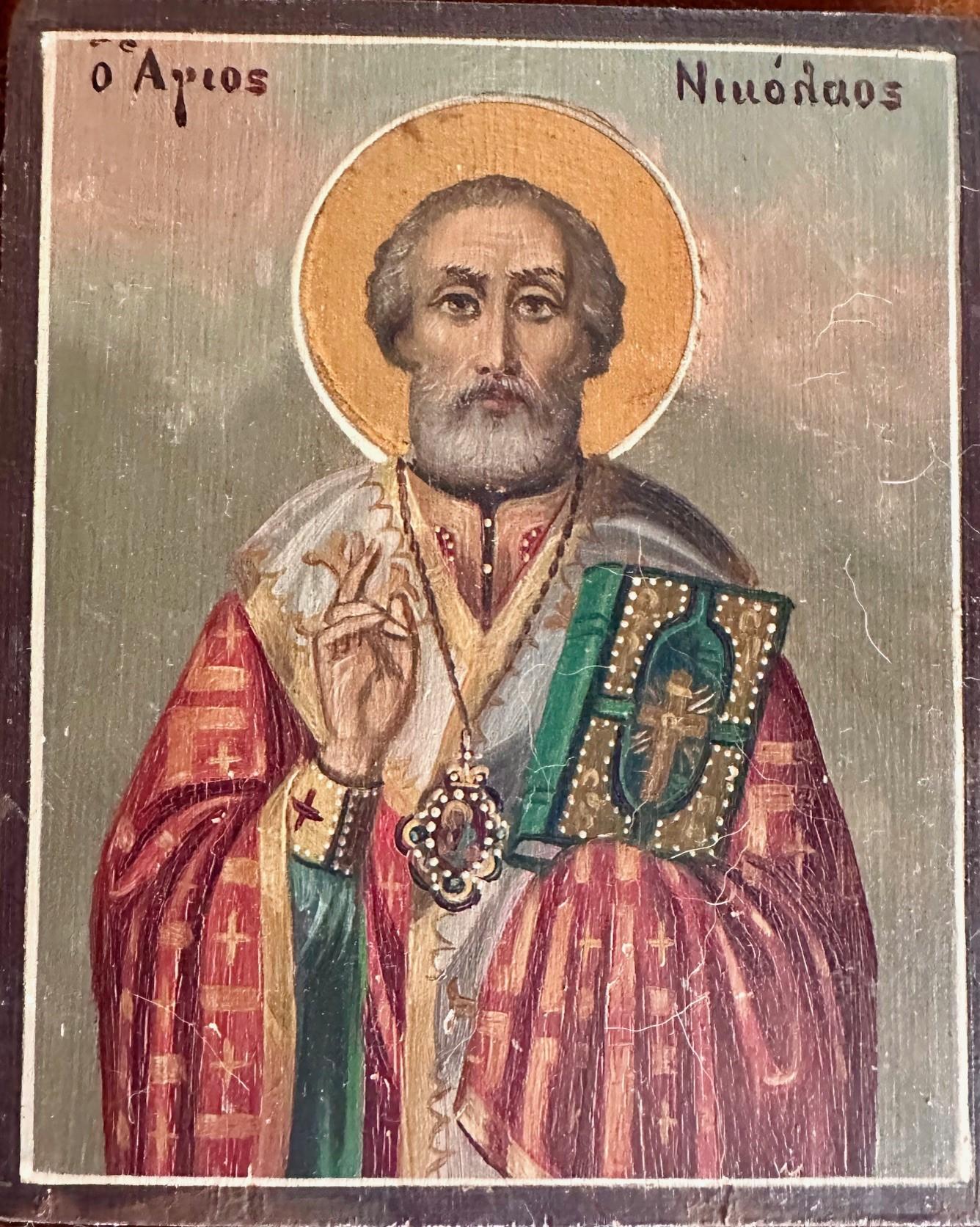 Vintage Hand Painted Saint Nicholas Icon Orthodox Church

The hand painted icon is mounted on velvet and framed in a beautiful Renaissance style wood frame.  The wood panel features St. Nicholas the Miracle Worker as he holds the compiled Gospels in
