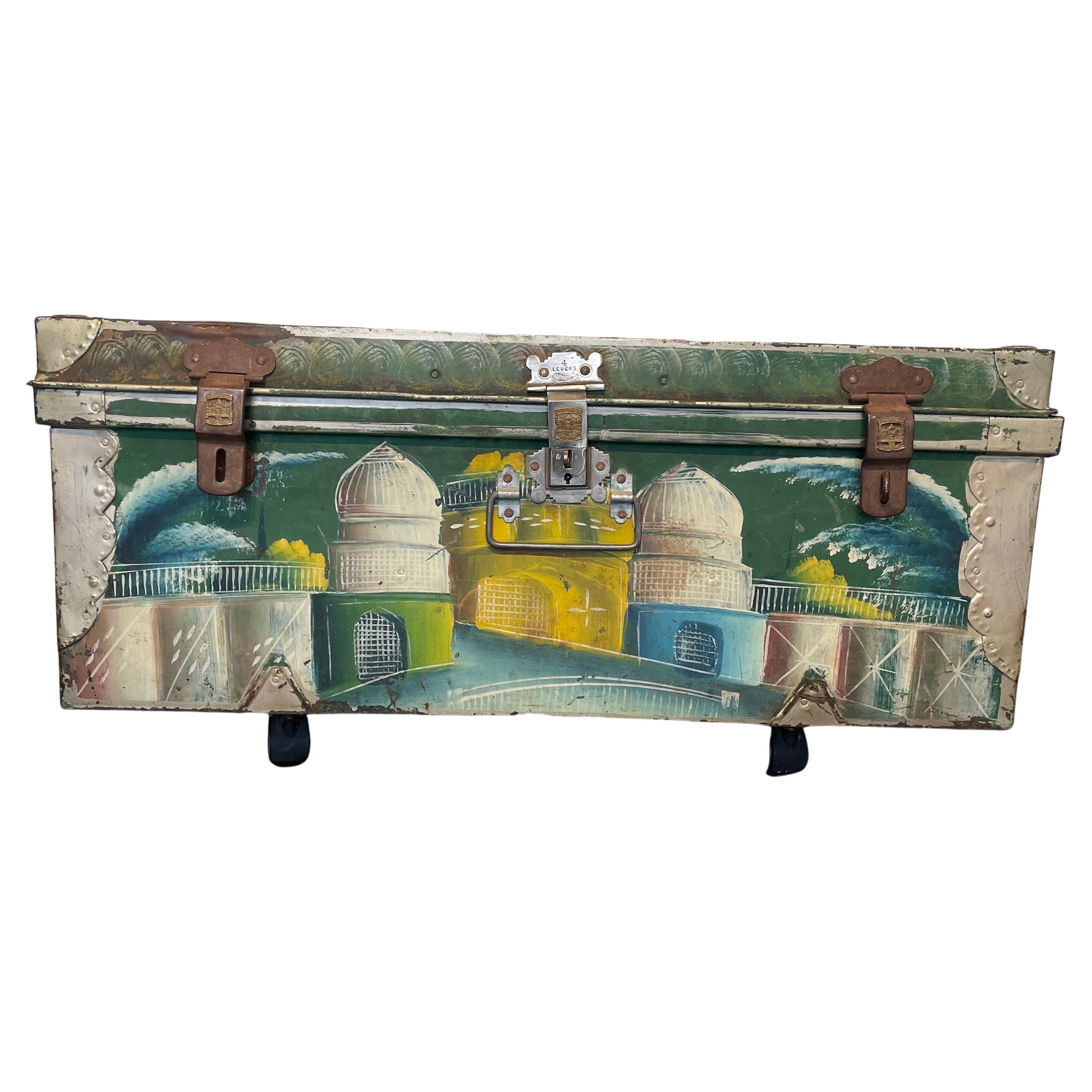 Vintage suitcase trunk hand painted with elaborate scenes of India, maker's mark Khwaja, Bombay, India. This eye catching trunk is a beautiful addition to any decor in your home. The colorful landscape scenes are set against a prominent green