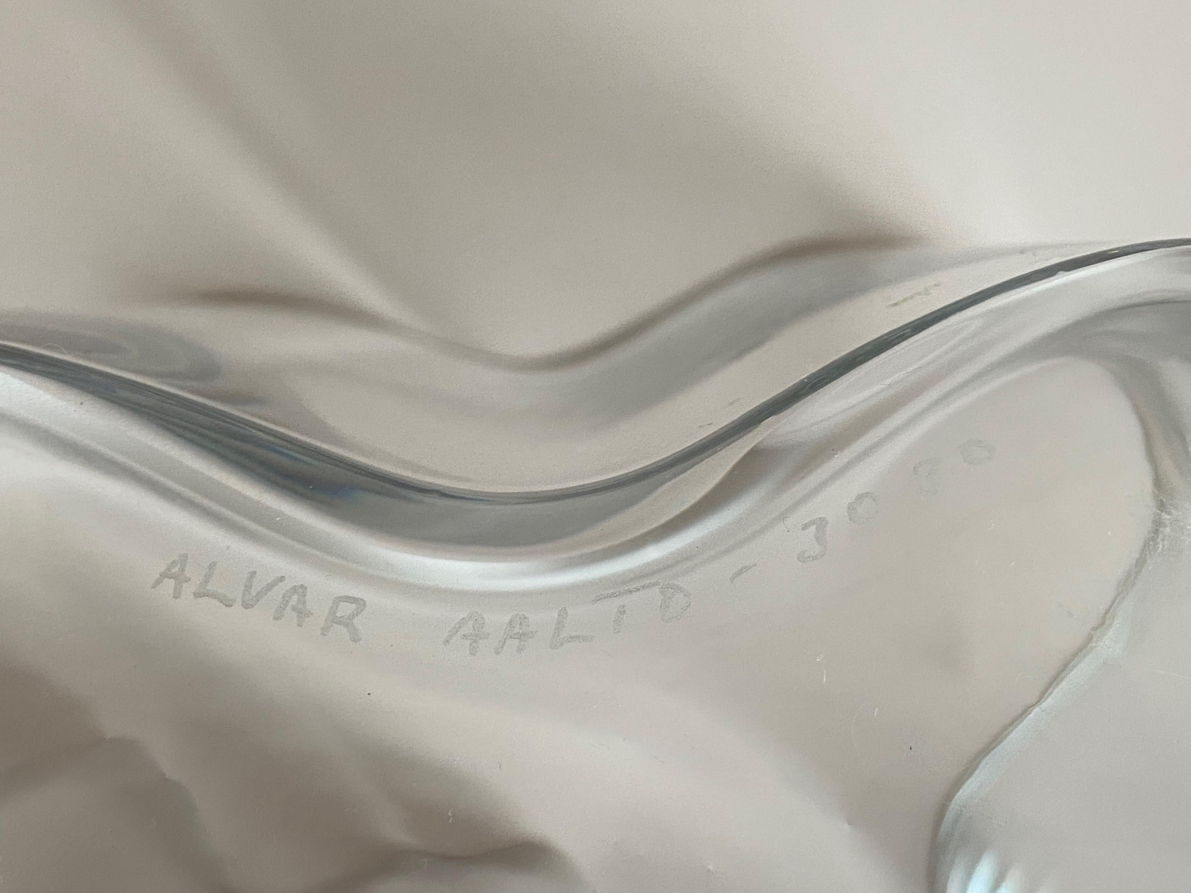 Hand signed Alvar Aalto vase 3030 Savoy for Iittala made in Finland. Nice vintage condition with some scratches at the base and one Fleabite.