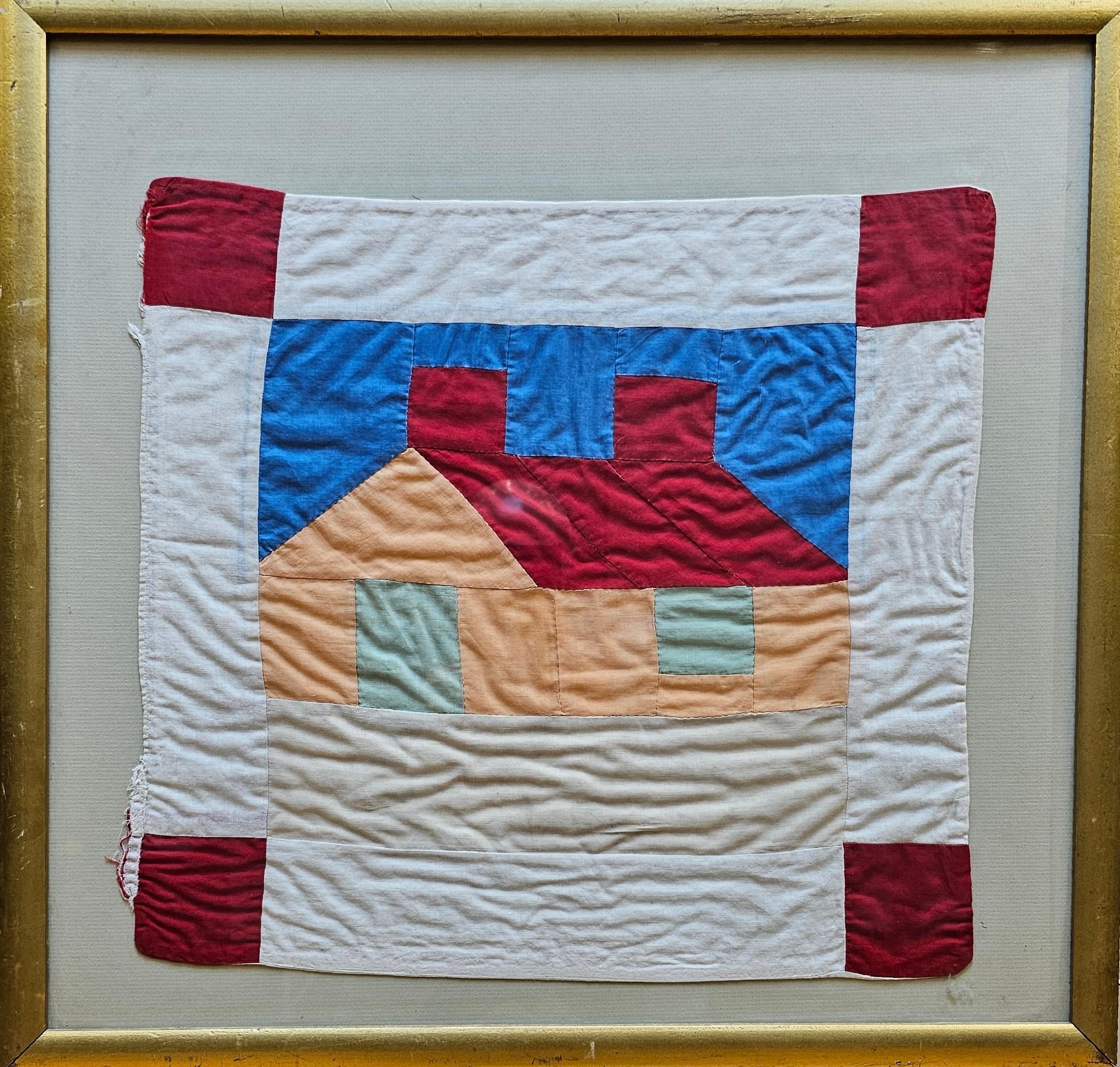 17.5” x 18.5” x. .1”    Charming vintage hand stitched small quilt depicting a house in red, peach, green blue, and ivory from the mid 1900s.  The quilt is beautifully mounted and is in a glassed wood frame.   

Dimensions:  Frame: 25” x 24” x .75”,