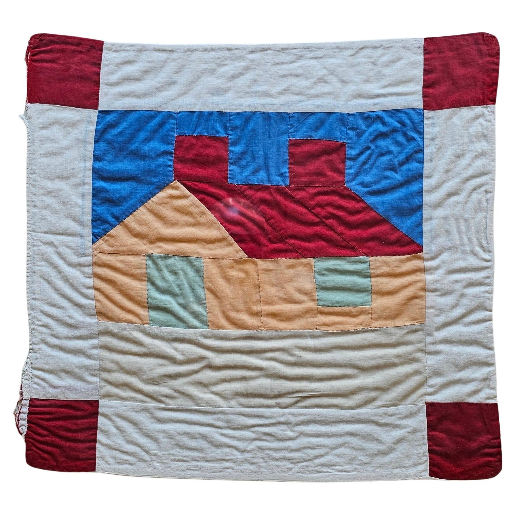 American Framed Hand Embroidered Vintage Crib Quilt of a Cabin in Red, Green, Peach, Blue For Sale